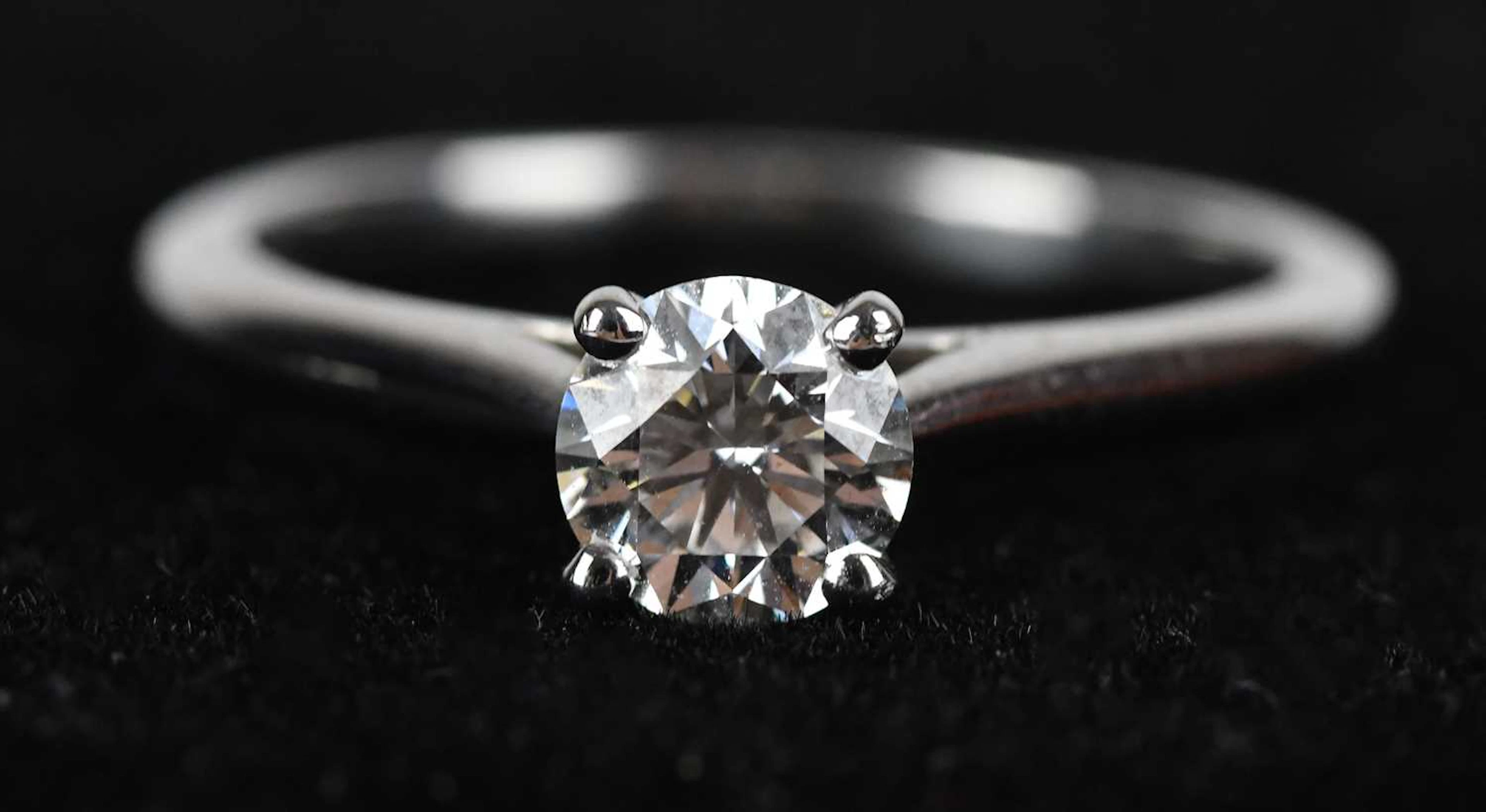 CARTIER; a platinum diamond solitaire ring