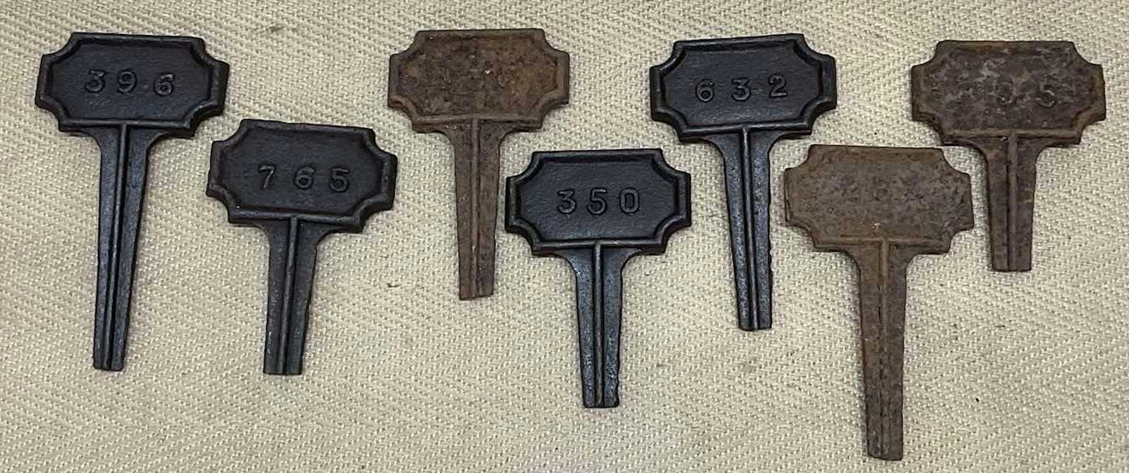 Seven 19th century cast iron grave markers