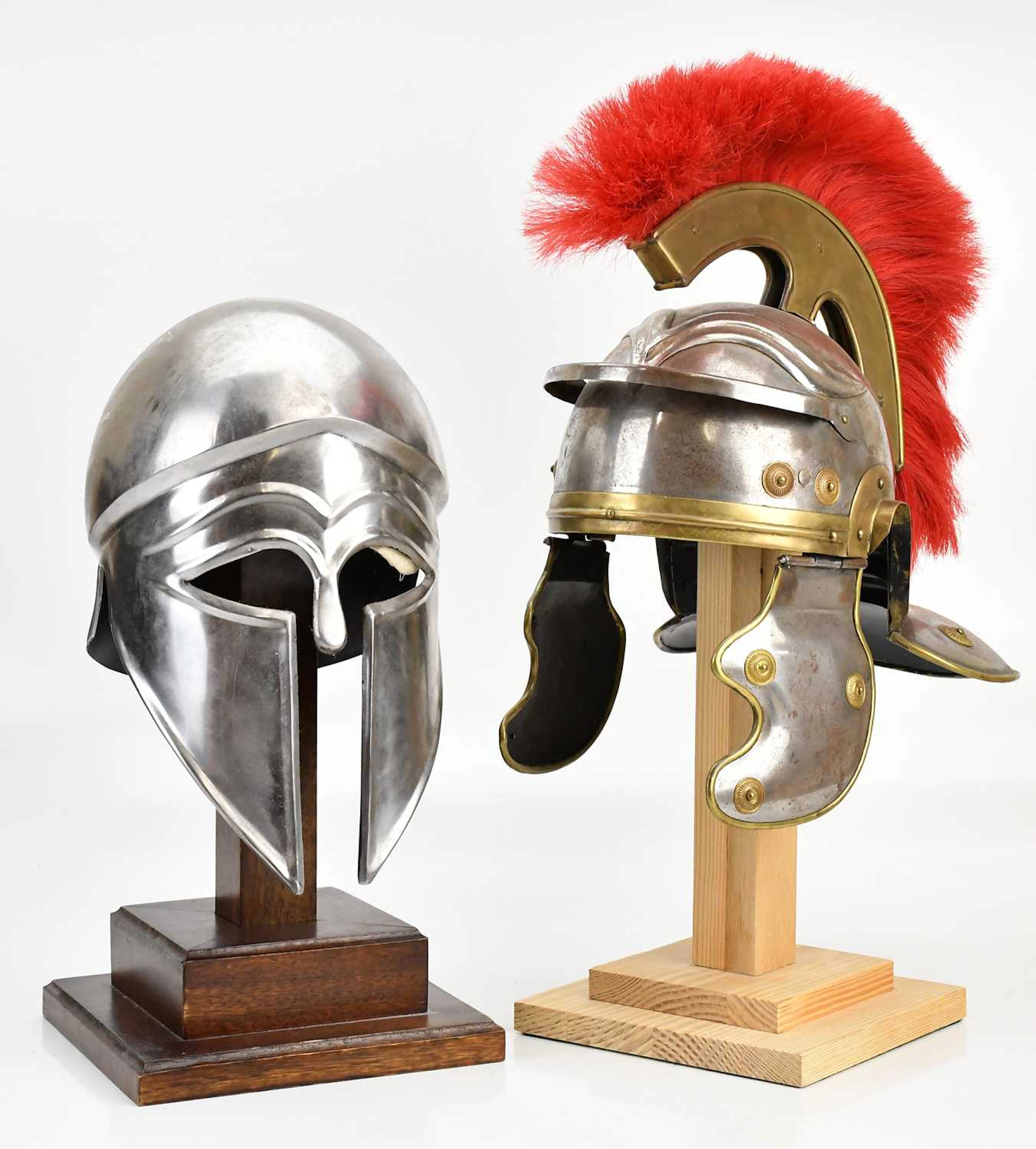 A reproduction Roman Centurion helmet and a reproduction Greek Corinthian helmet