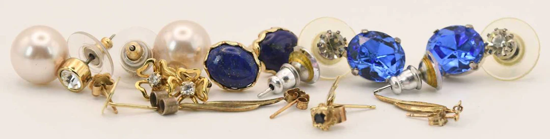 Various earrings including a pair of 18ct yellow gold diamond set floral studs