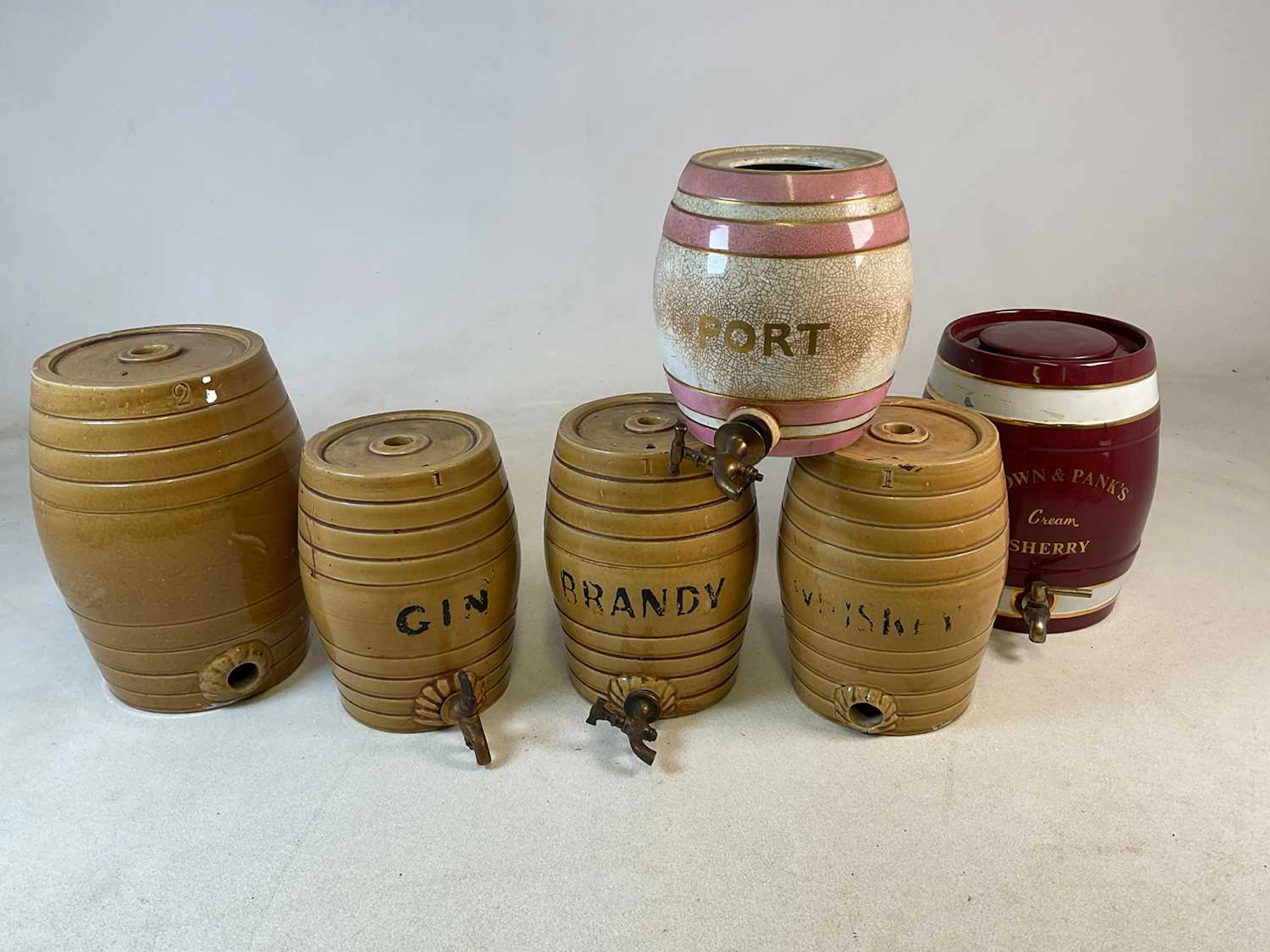 A quantity of ceramic and stoneware barrels