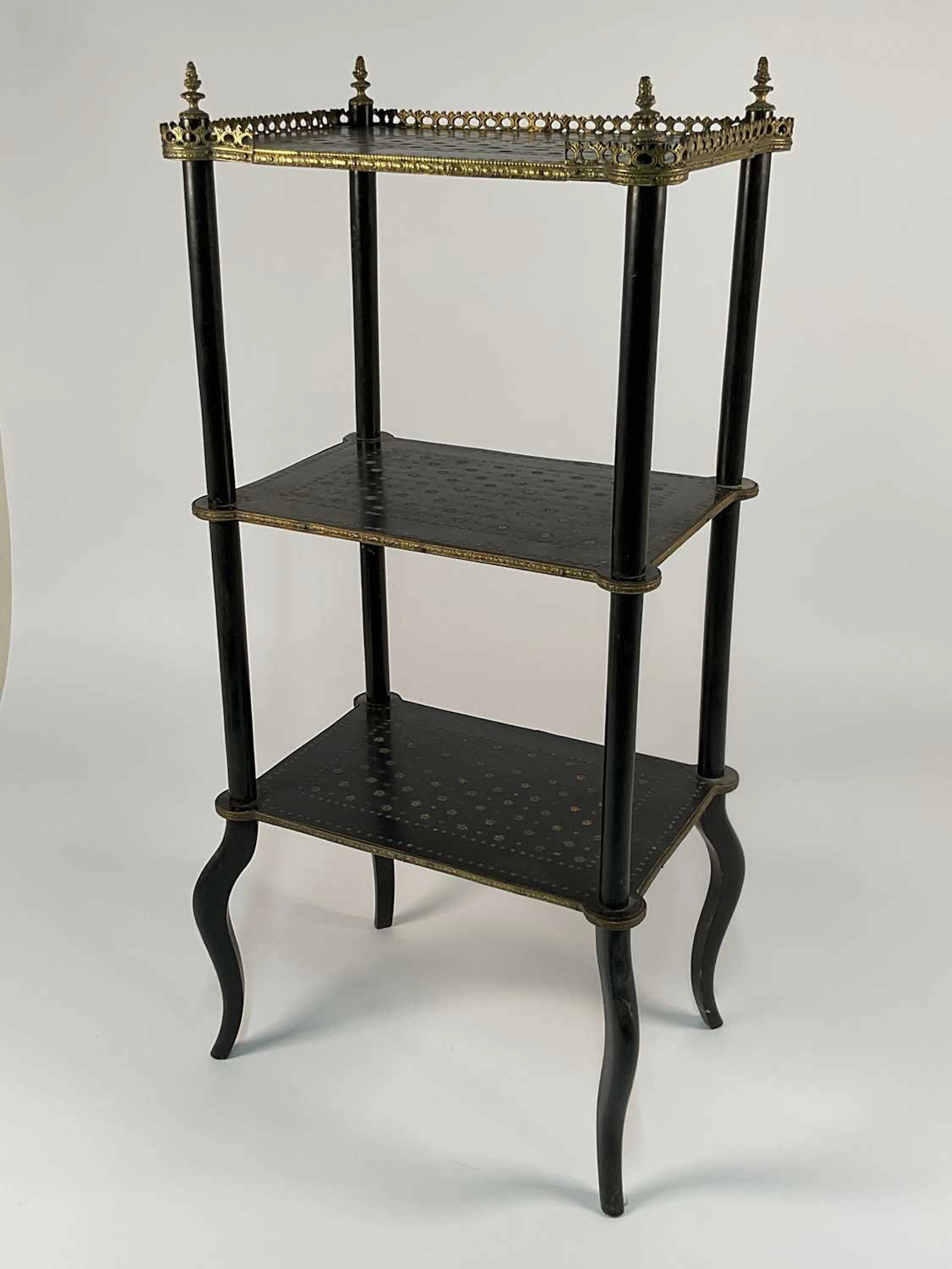A 19th century ebonised three tier what not with brass...