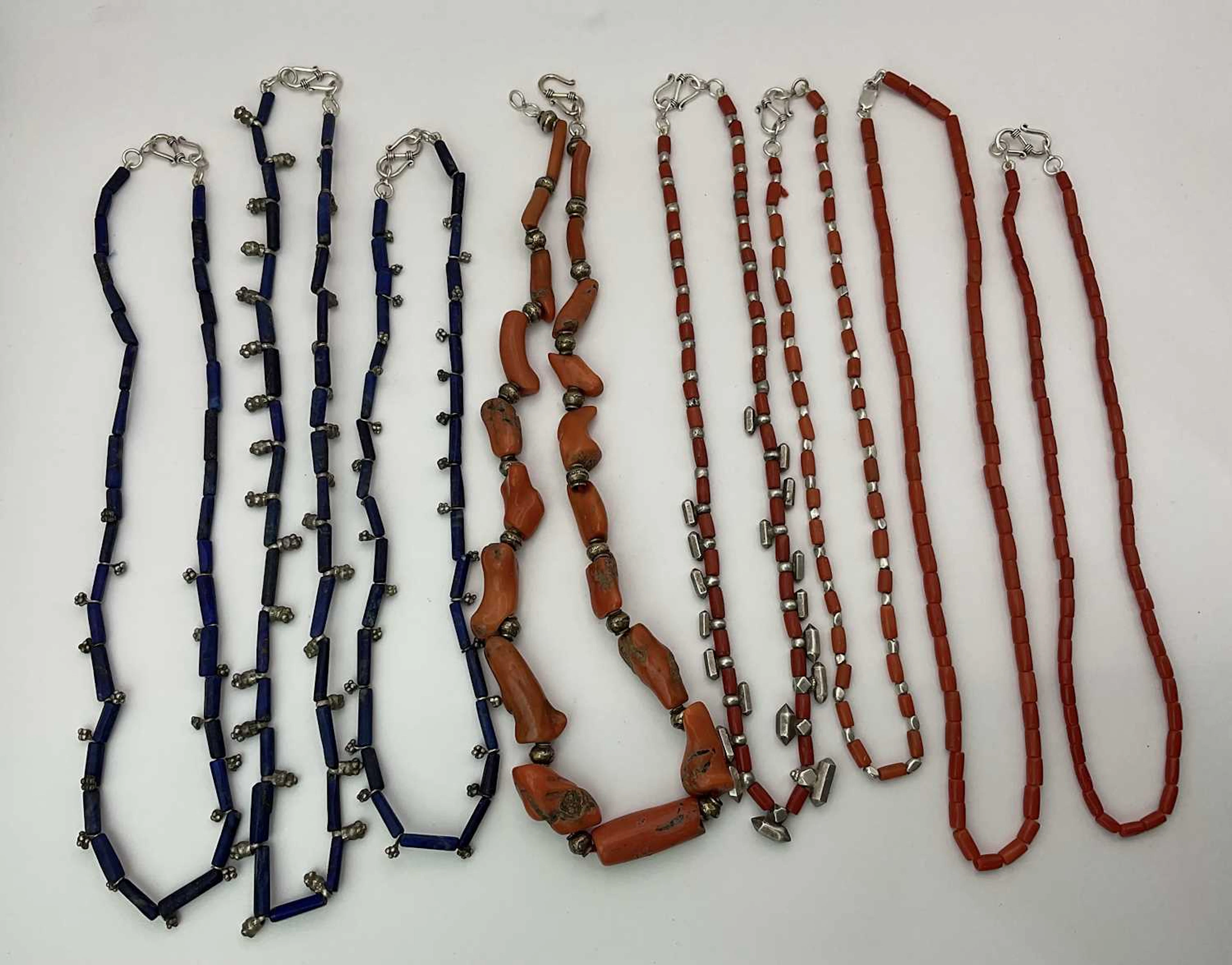 Five coral and three lapis decorative necklaces
