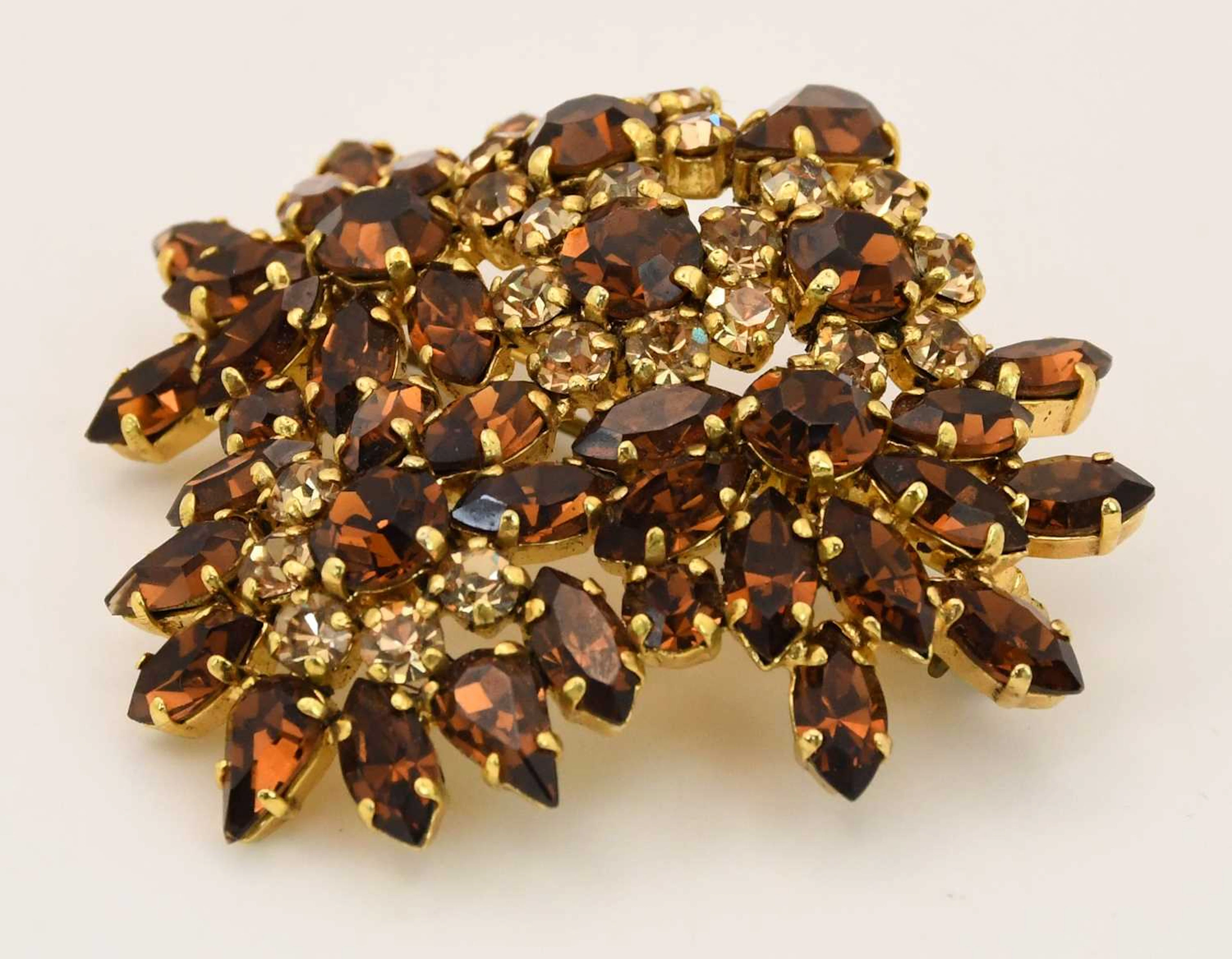 CHRISTIAN DIOR; a vintage gold plated amber glass stone set floral spray brooch