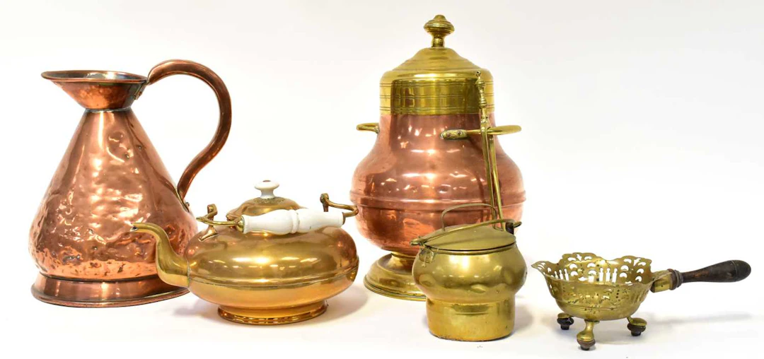Six brass and copperware items comprising a covered twin handled pot