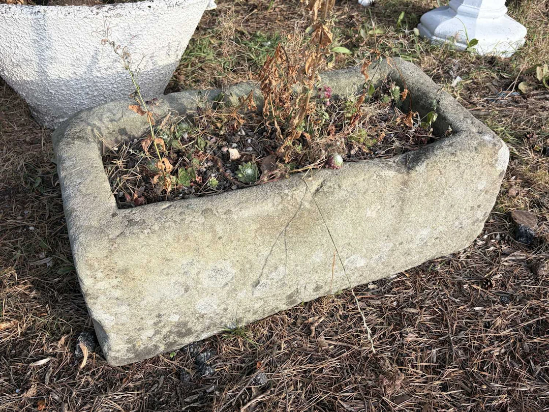 A sandstone garden trough