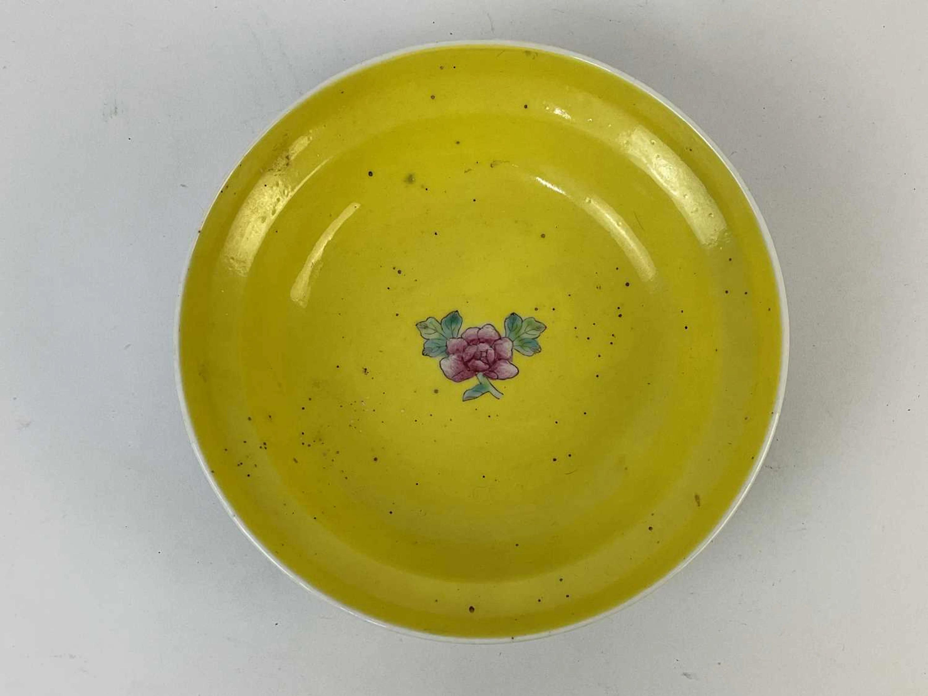 A Chinese porcelain bowl with turquoise ground and Famille Rose floral motifs