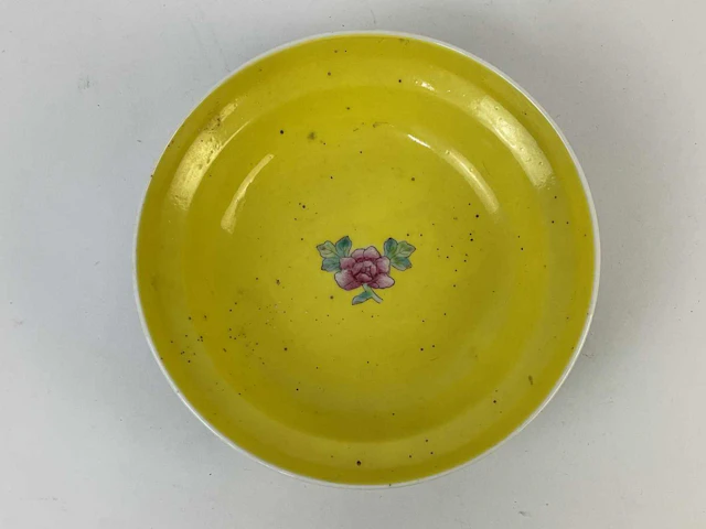 A Chinese porcelain bowl with turquoise ground and Famille Rose floral motifs