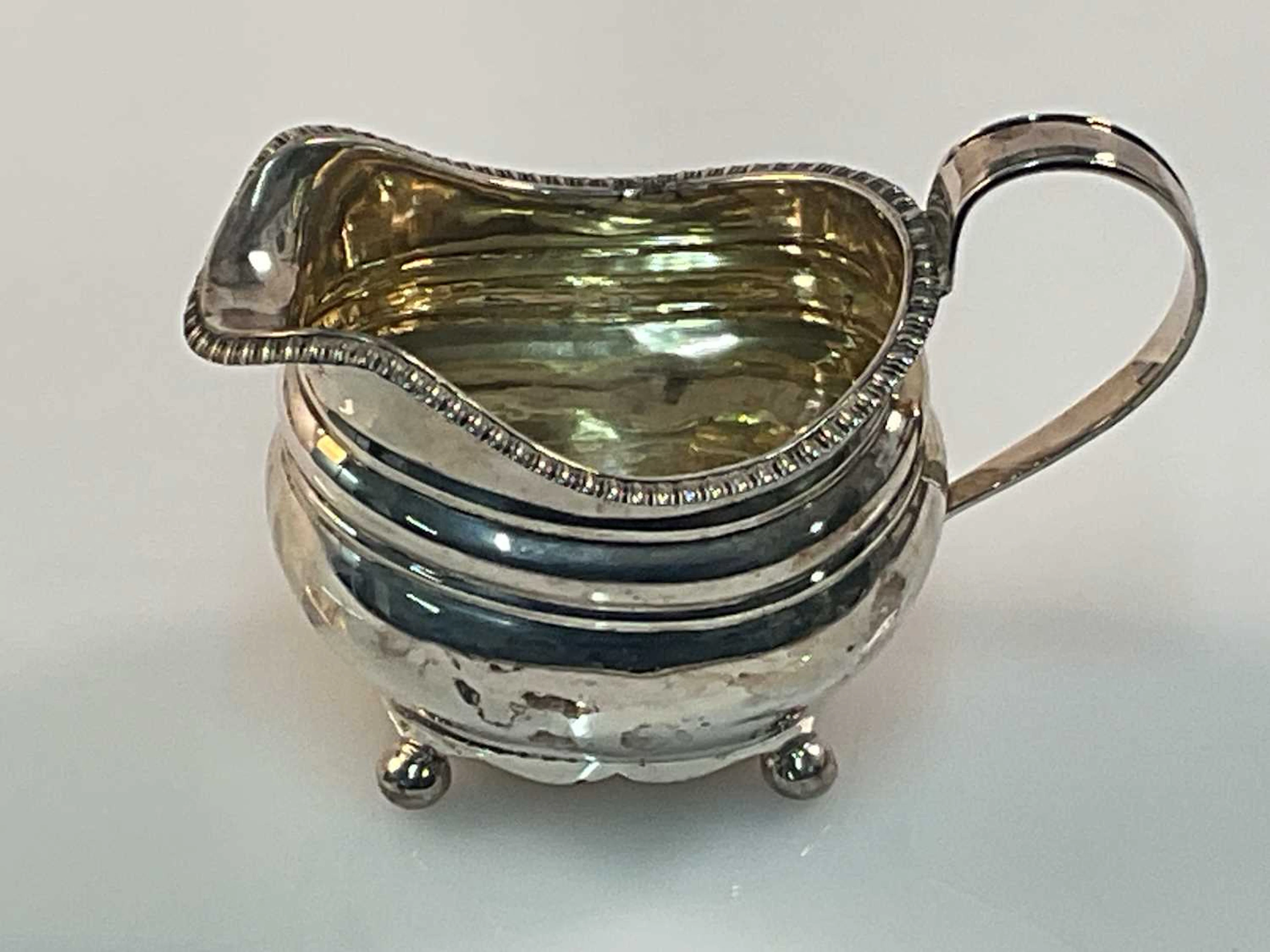 R B; a George III hallmarked silver jug