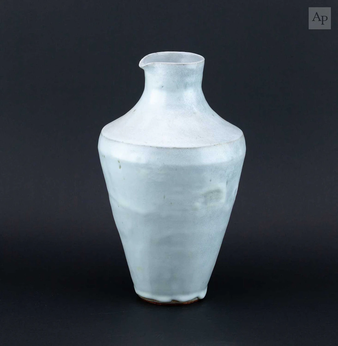 CHLOE ROSETTA BELL; a tall stoneware pouring vessel...