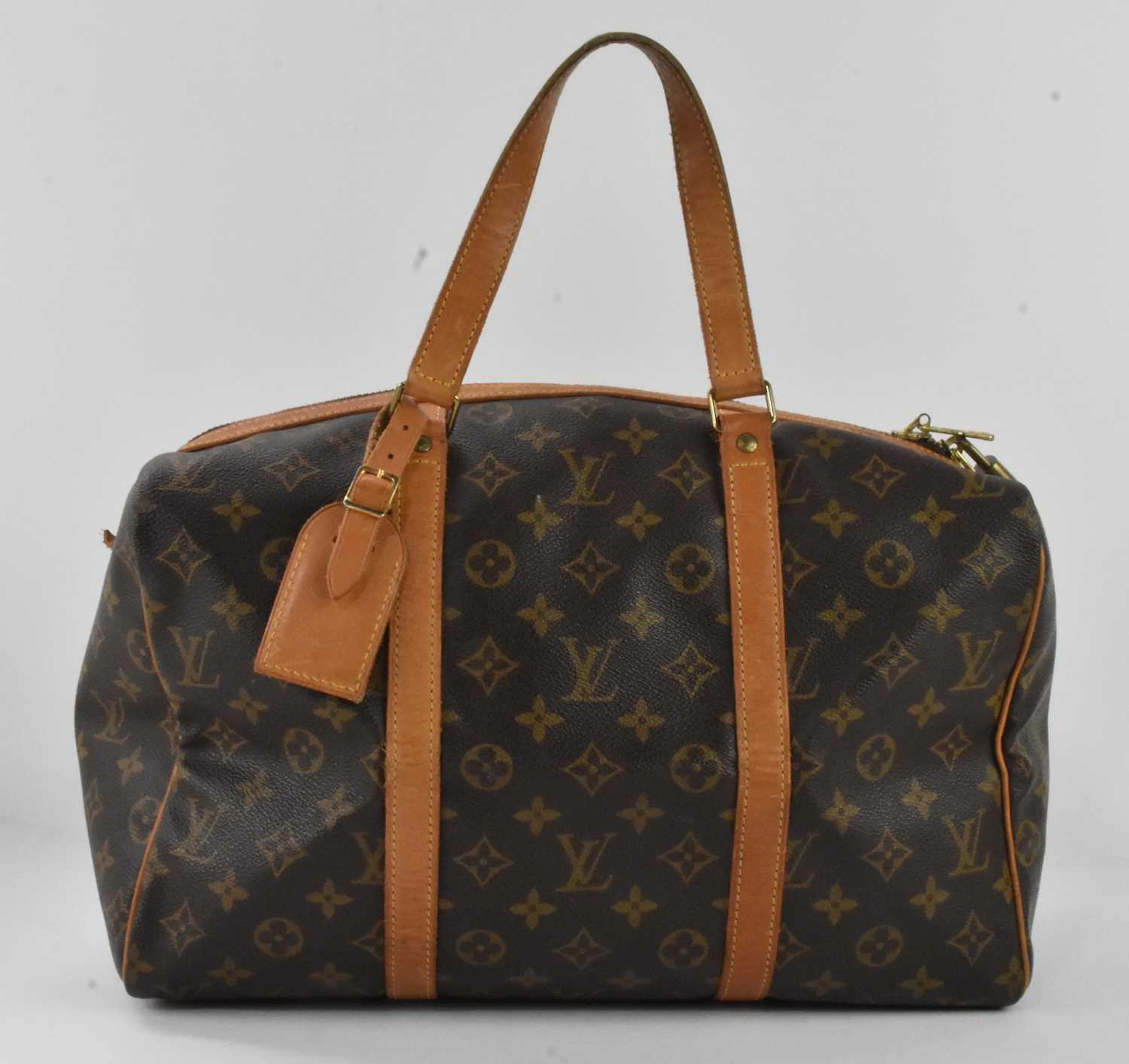 LOUIS VUITTON; a vintage 'Sac Souple' brown monogram leather handbag