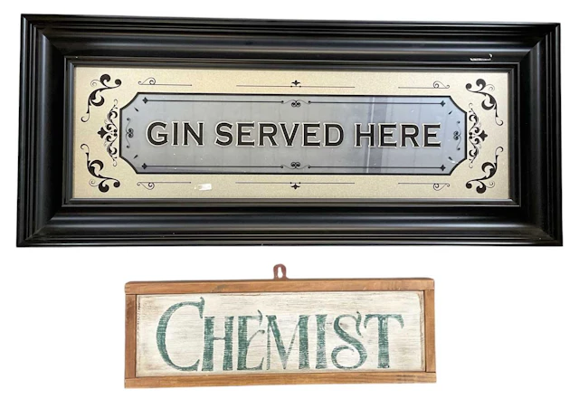 A vintage mirrored sign