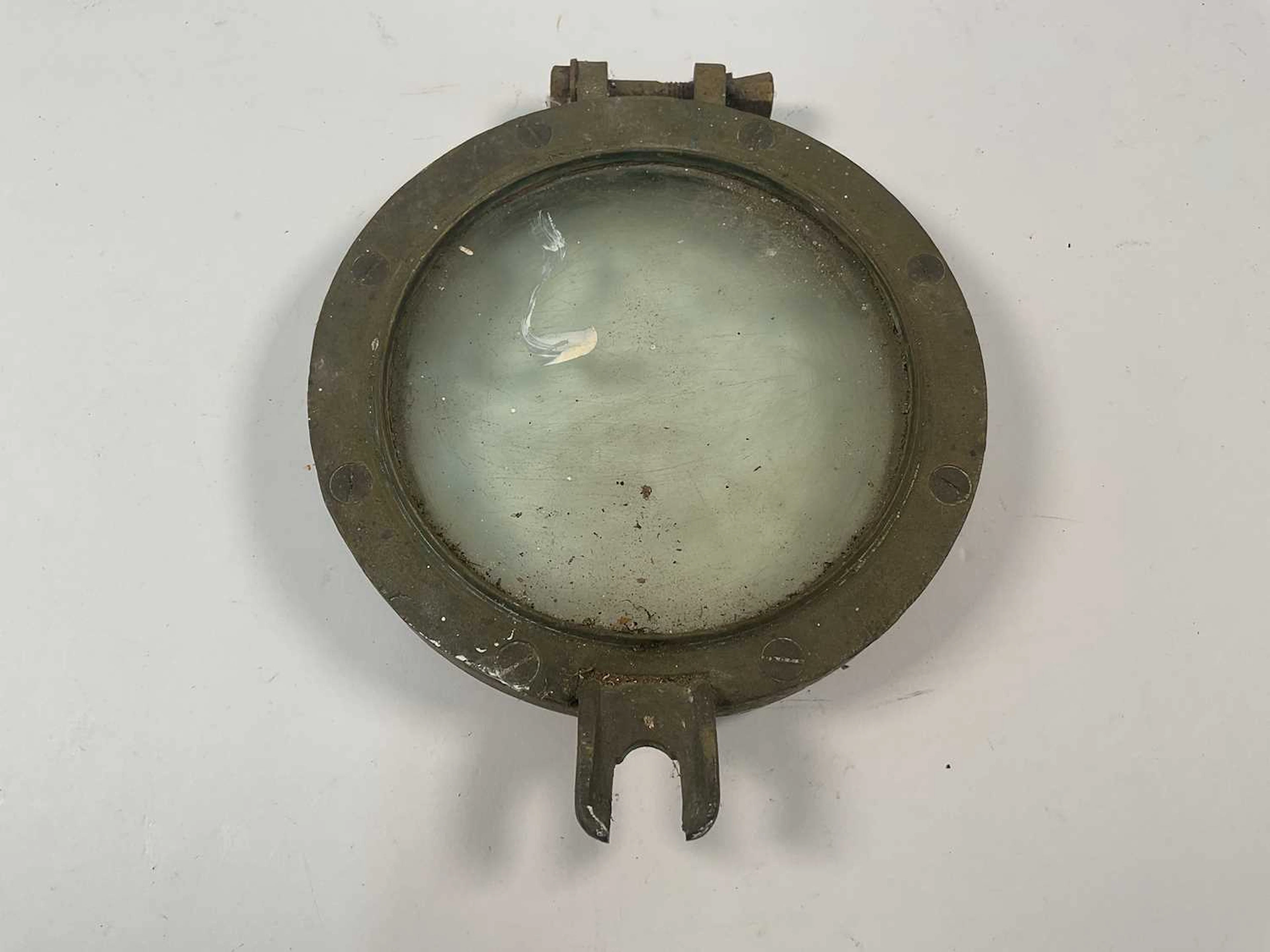 A small brass ship's portal outer