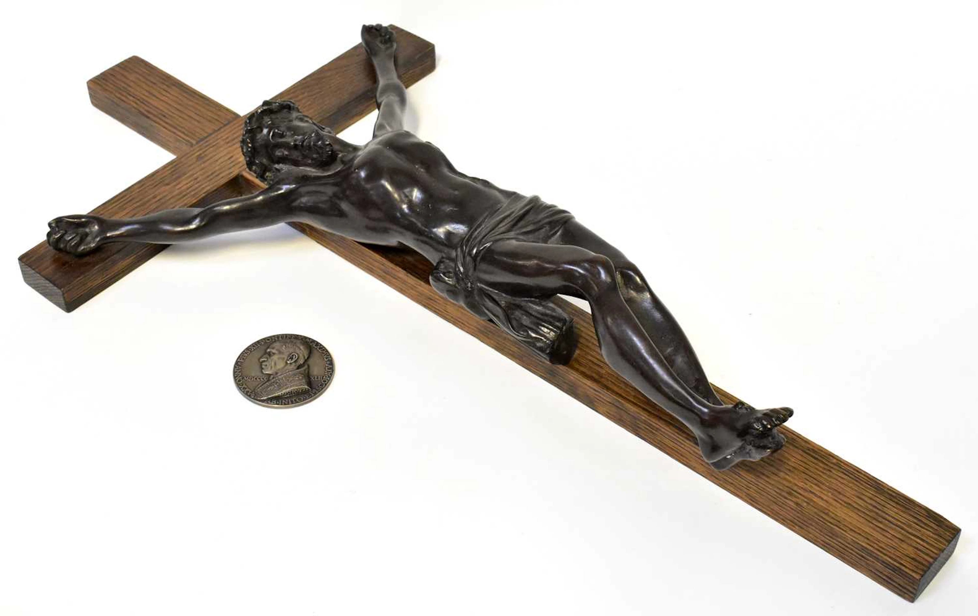 A 20th century spelter sculpture of Christ on a wooden cross