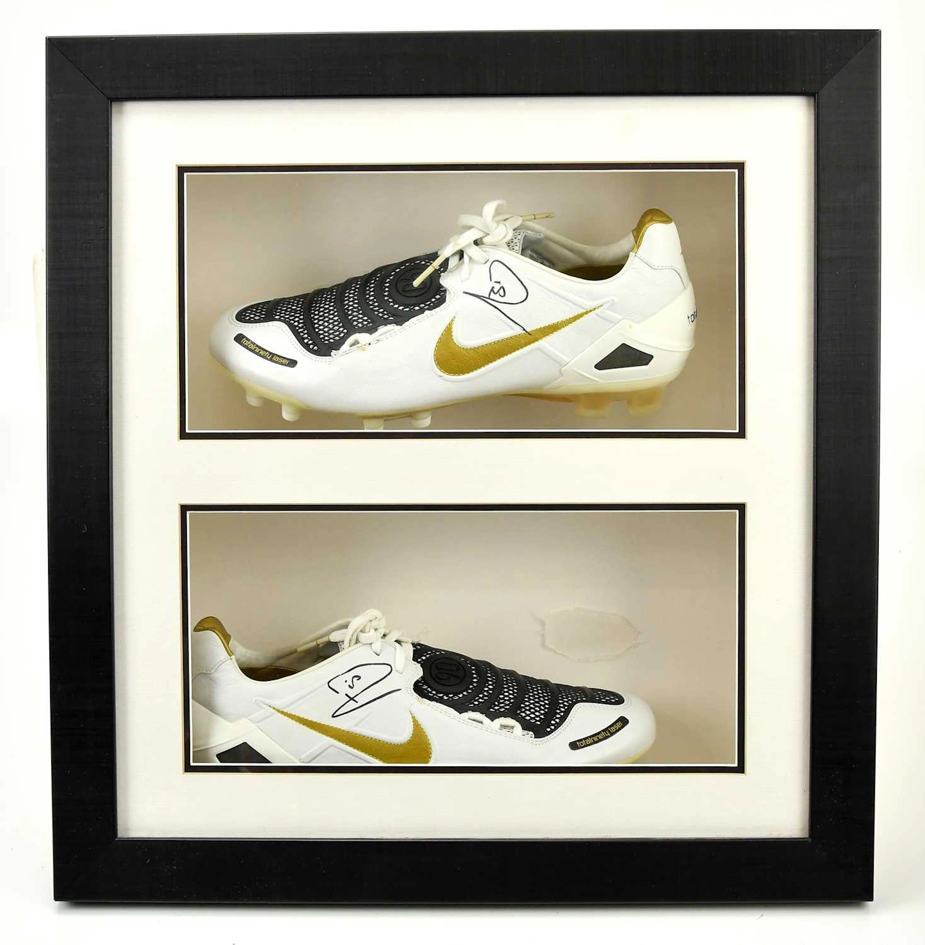 RIO FERDINAND; a framed pair of autographed Nike Total 90 football boots