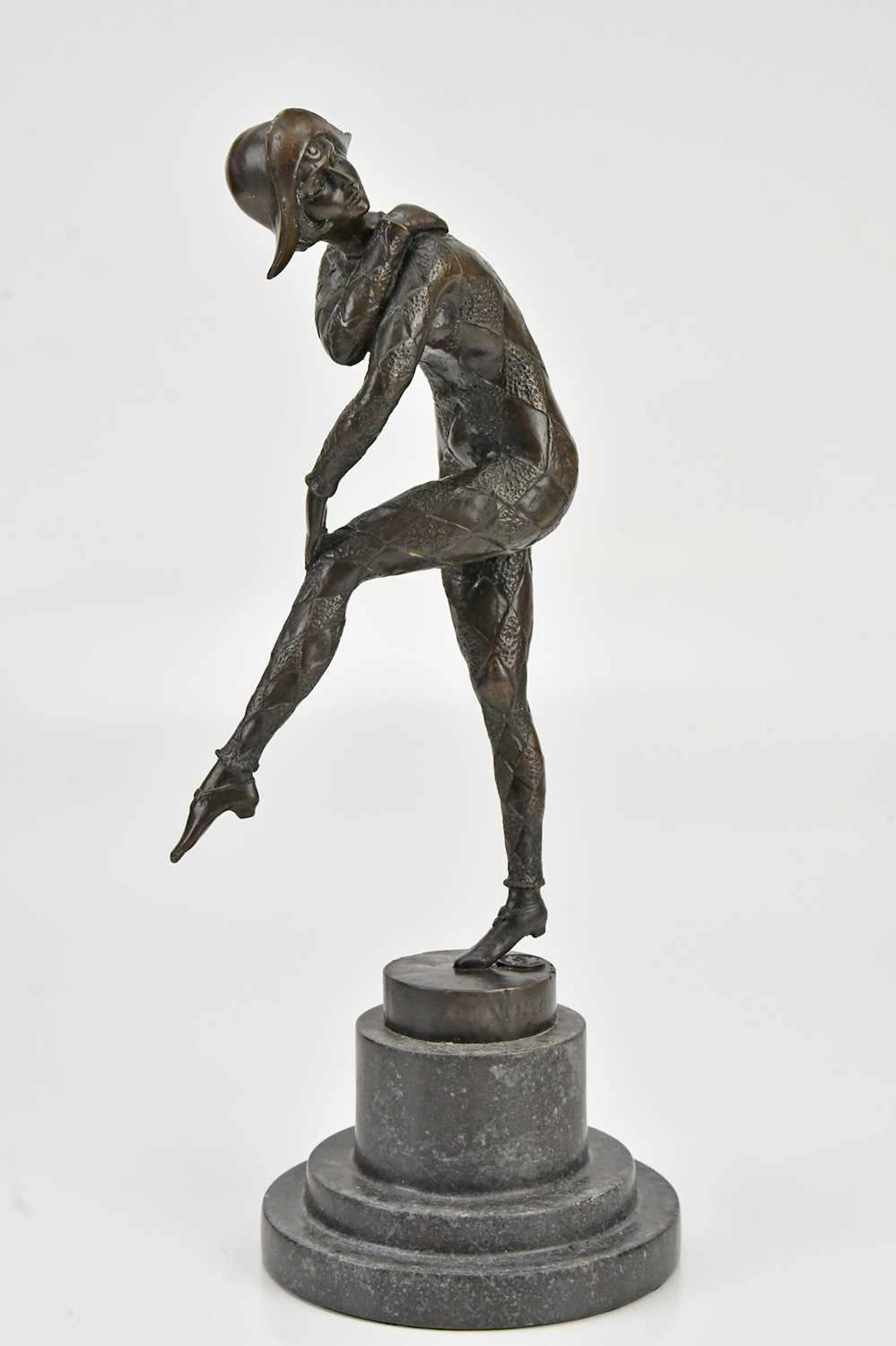 A bronze figure of a dancer
