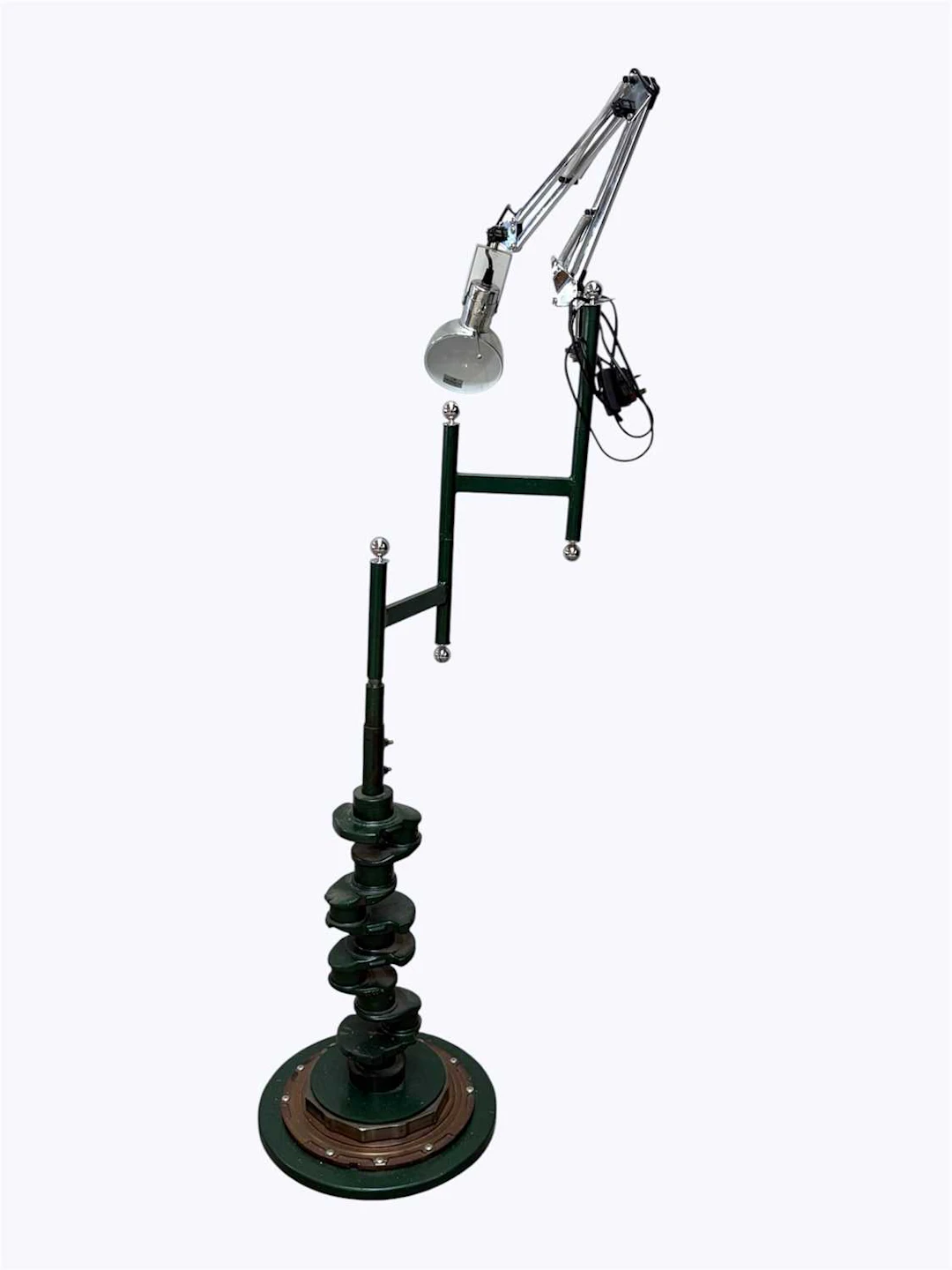 A steampunk style standard lamp constructed from a vehicle axle