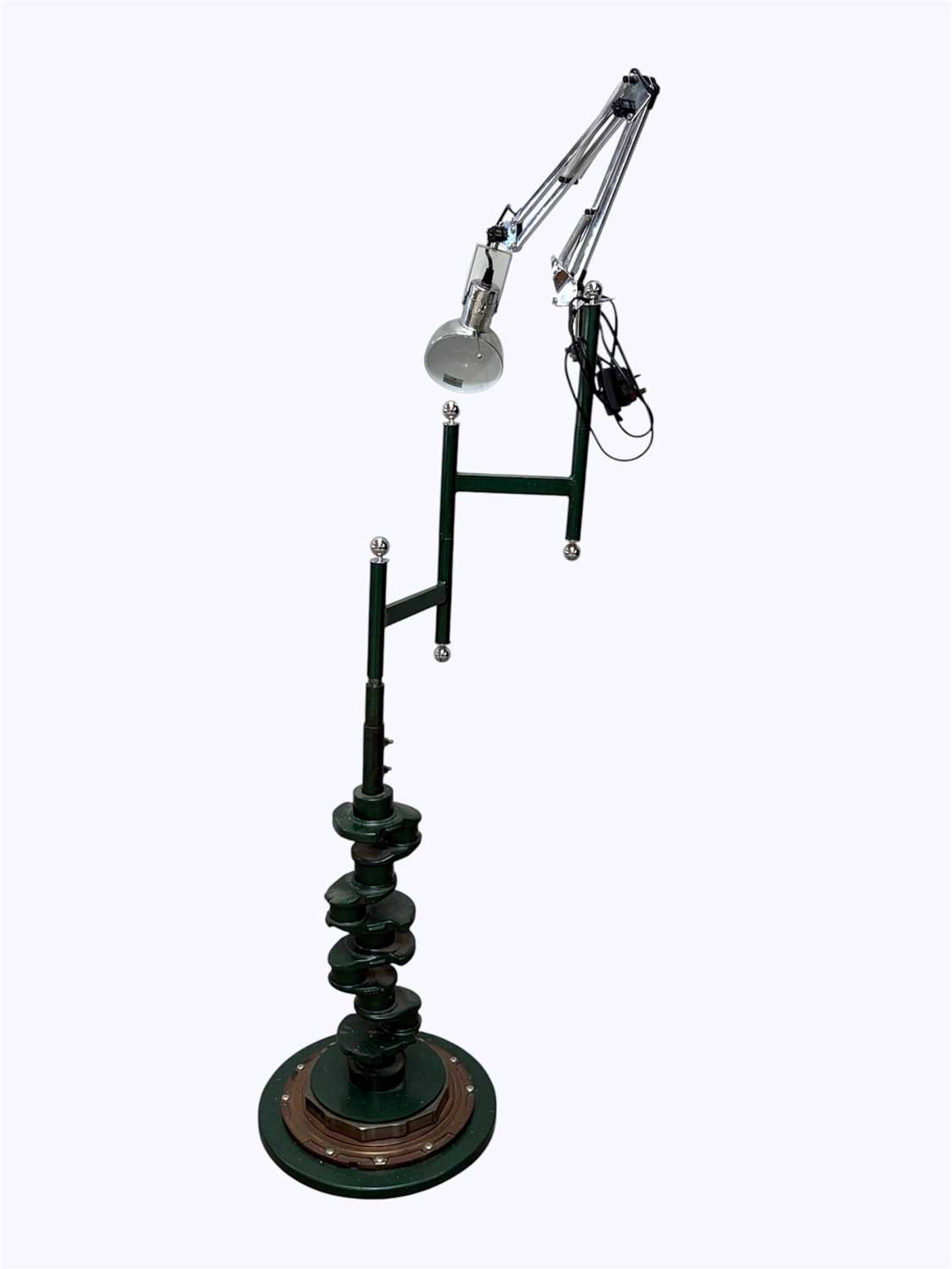 A steampunk style standard lamp constructed from a vehicle axle