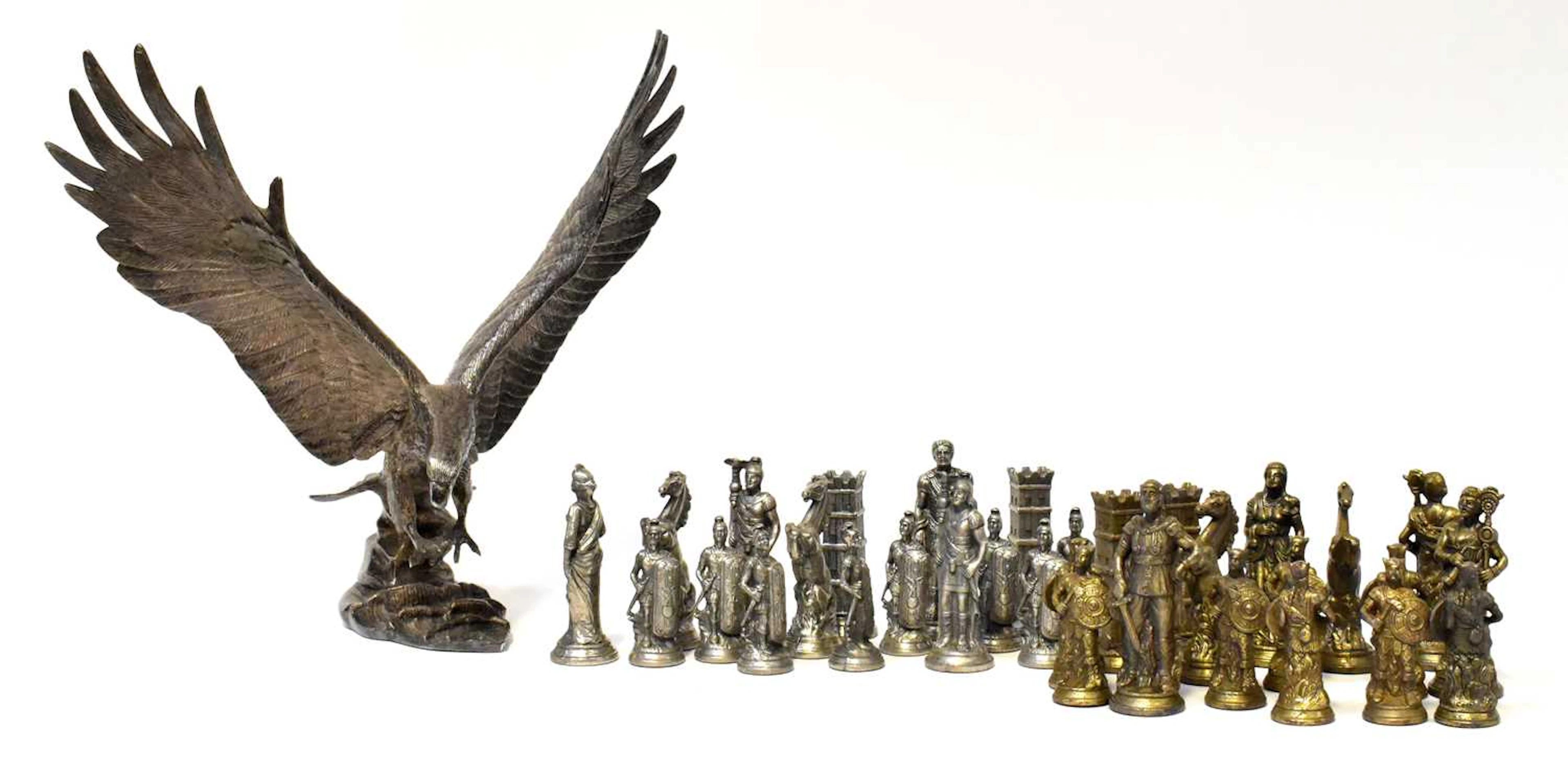A pewter model of an eagle on a texured base