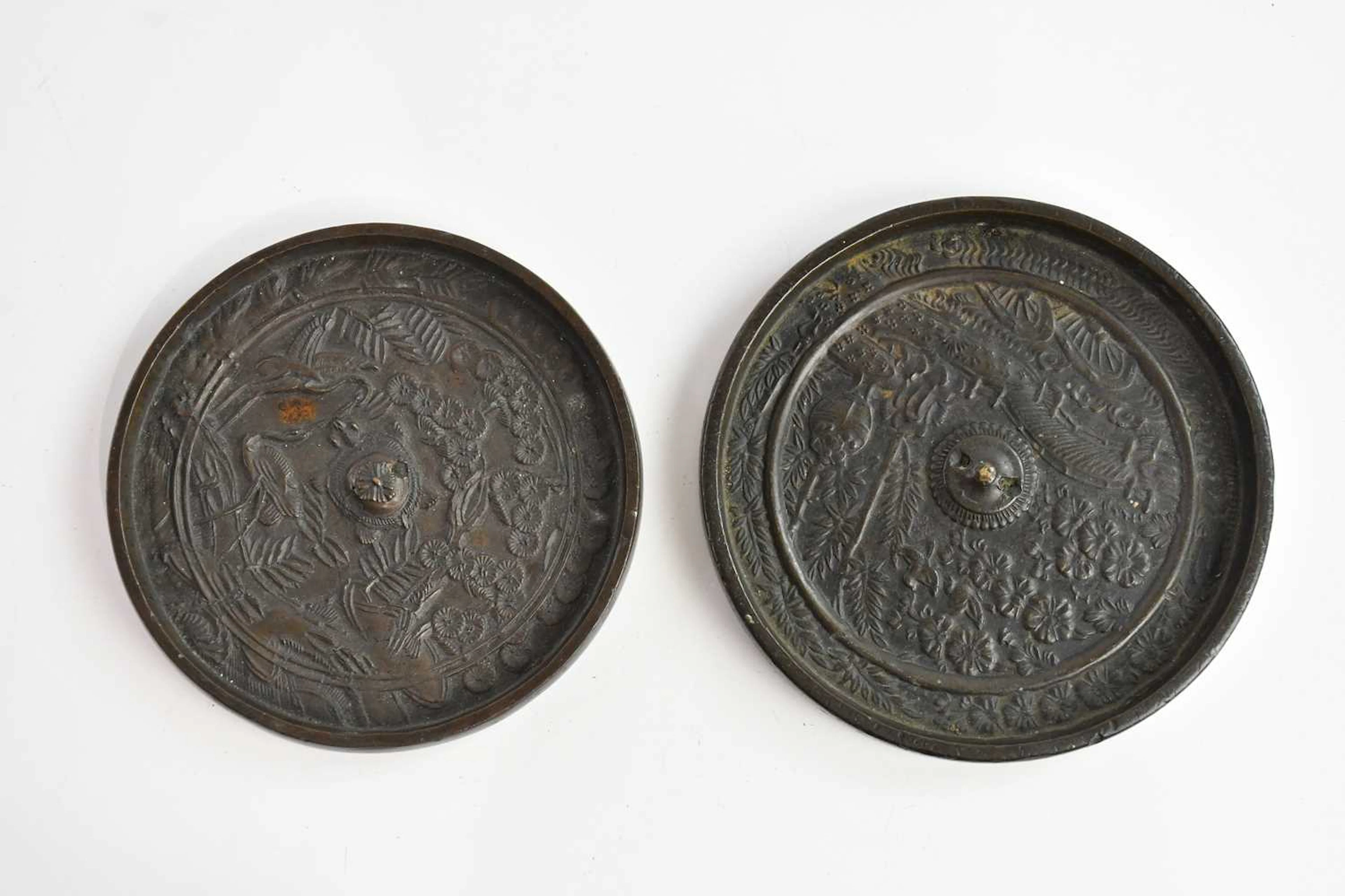 Two Chinese bronze mirrors of circular form