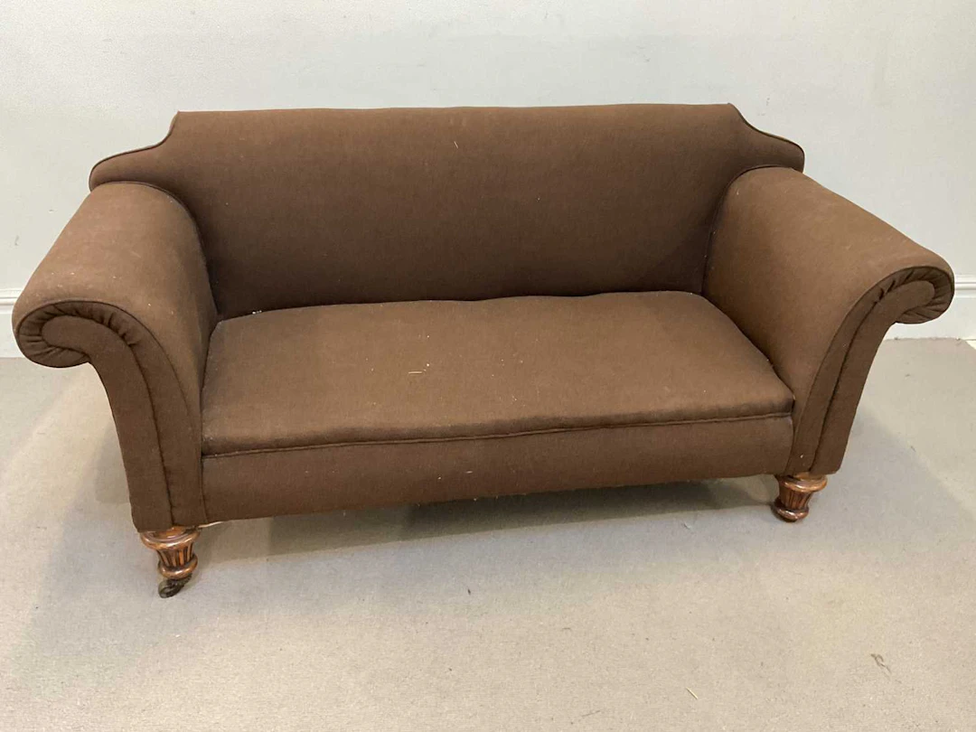 An Edwardian mahogany Chesterfield type library sofa