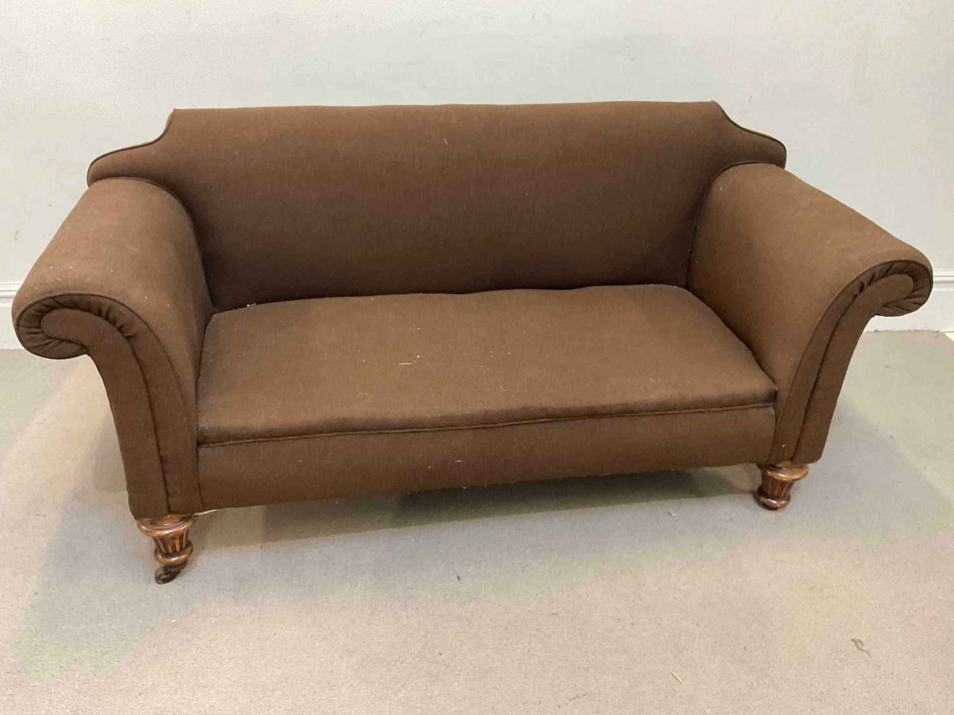 An Edwardian mahogany Chesterfield type library sofa