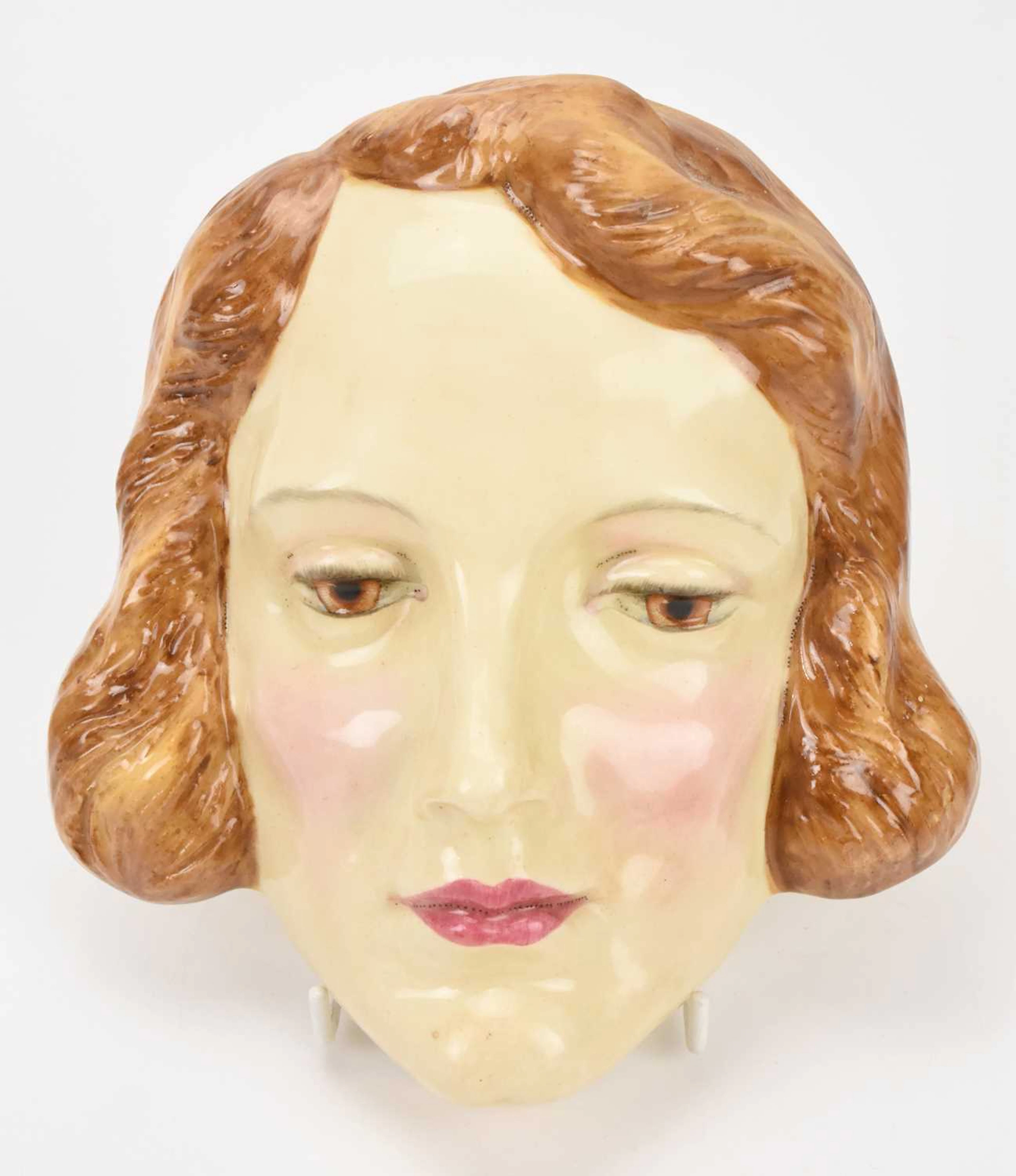 ROYAL DOULTON; a rare Art Deco wall mask representing Marlene Dietrich