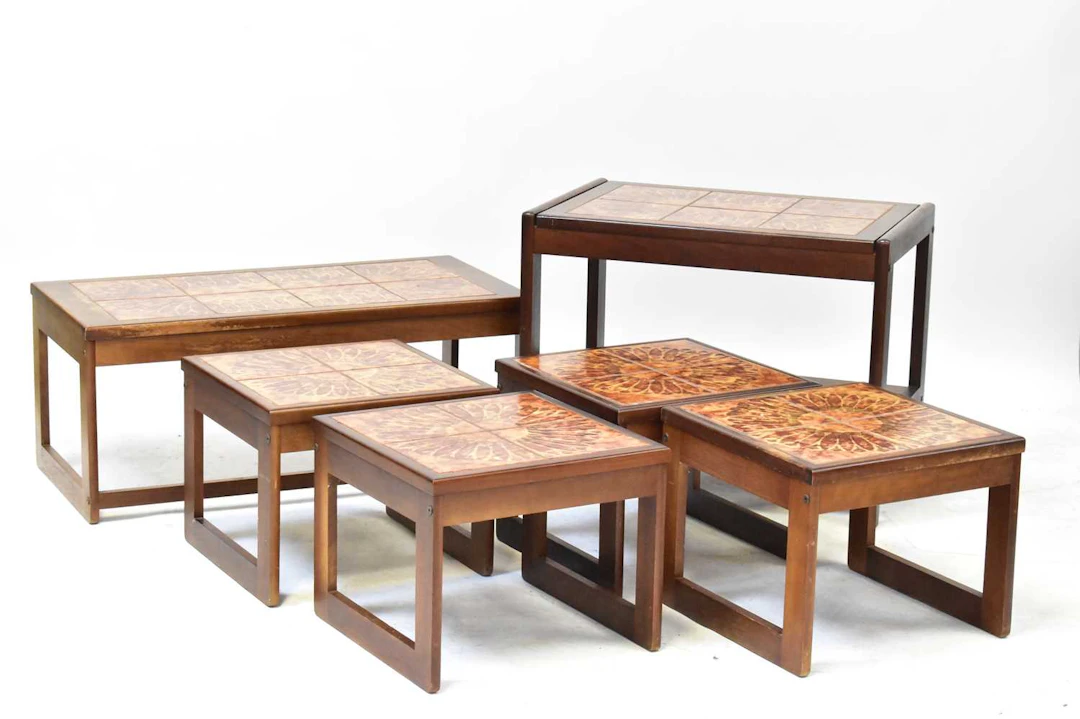 Six teak tile-topped occasional tables of various designs...