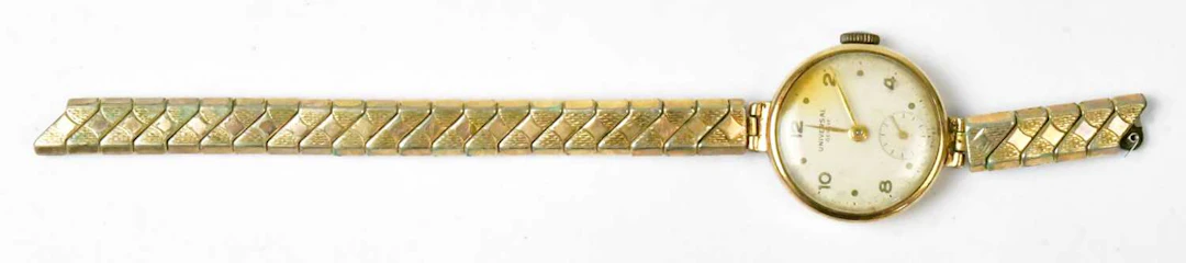 UNIVERSAL; a 9ct yellow gold cocktail watch head