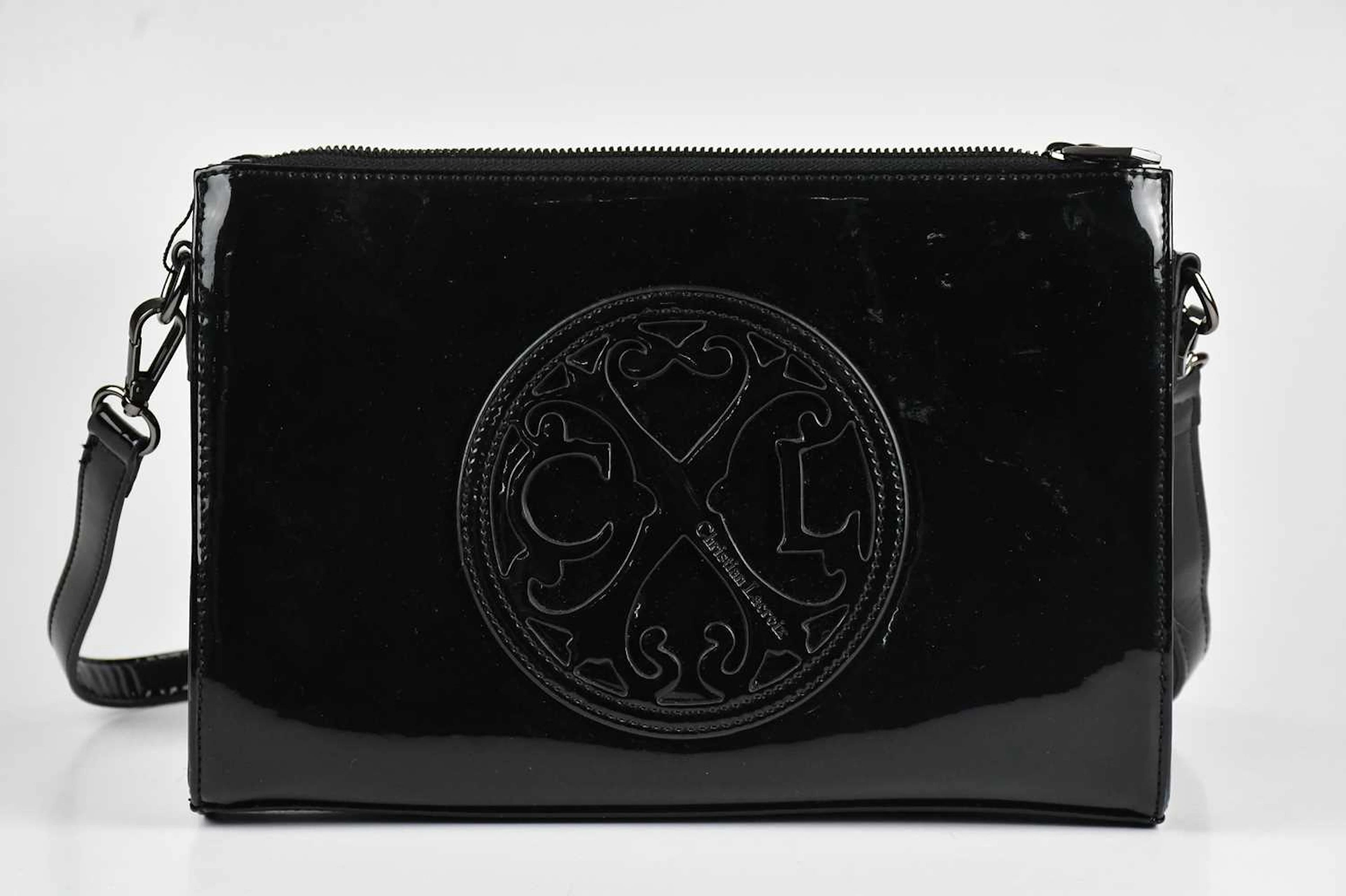 CHRISTIAN LACROIX; a black patent leather crossbody...