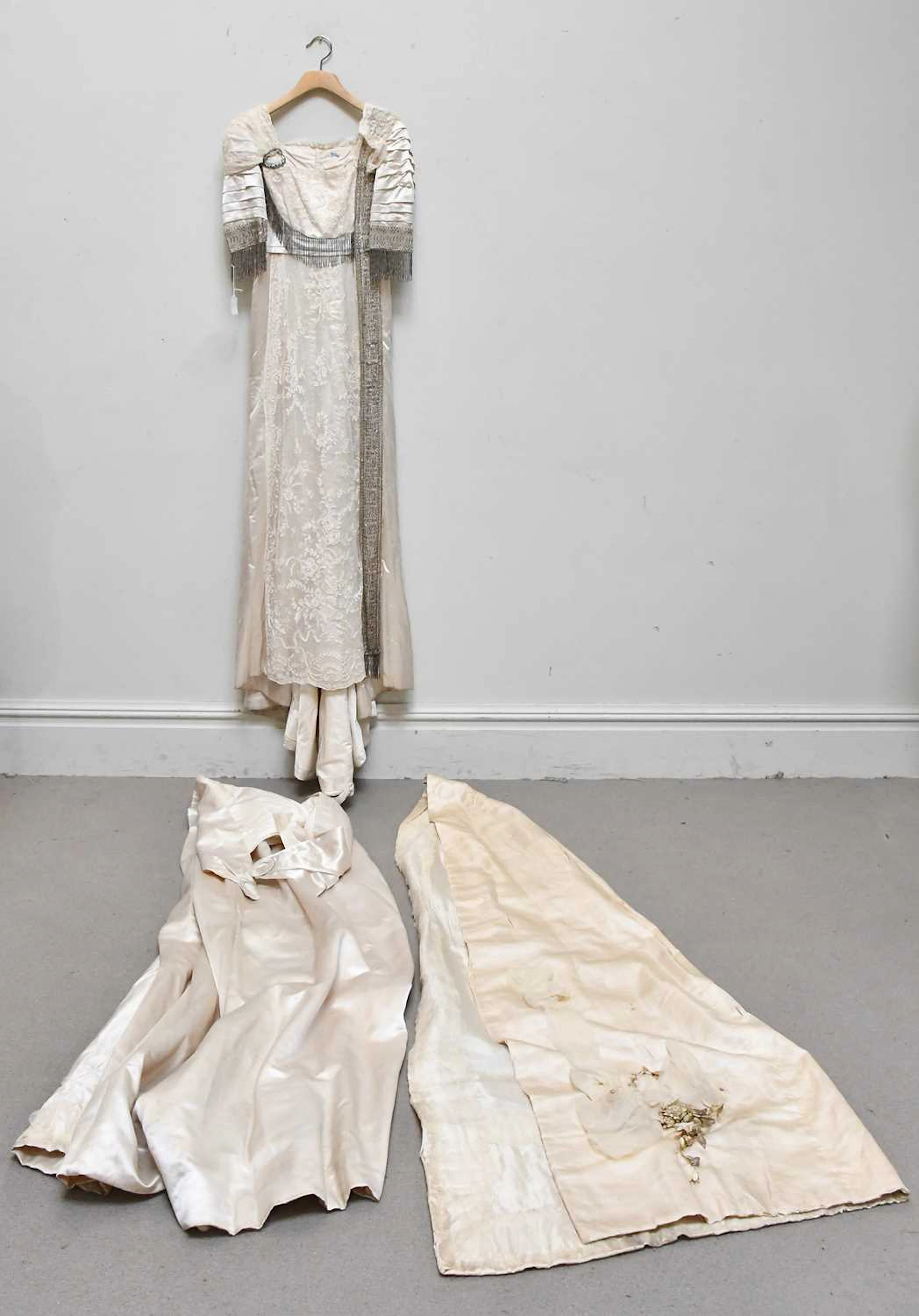 An Edwardian style cream silk satin full length wedding gown