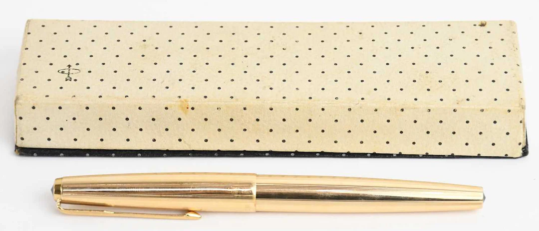 PARKER; a boxed 61 Insignia gold plated fountain pen