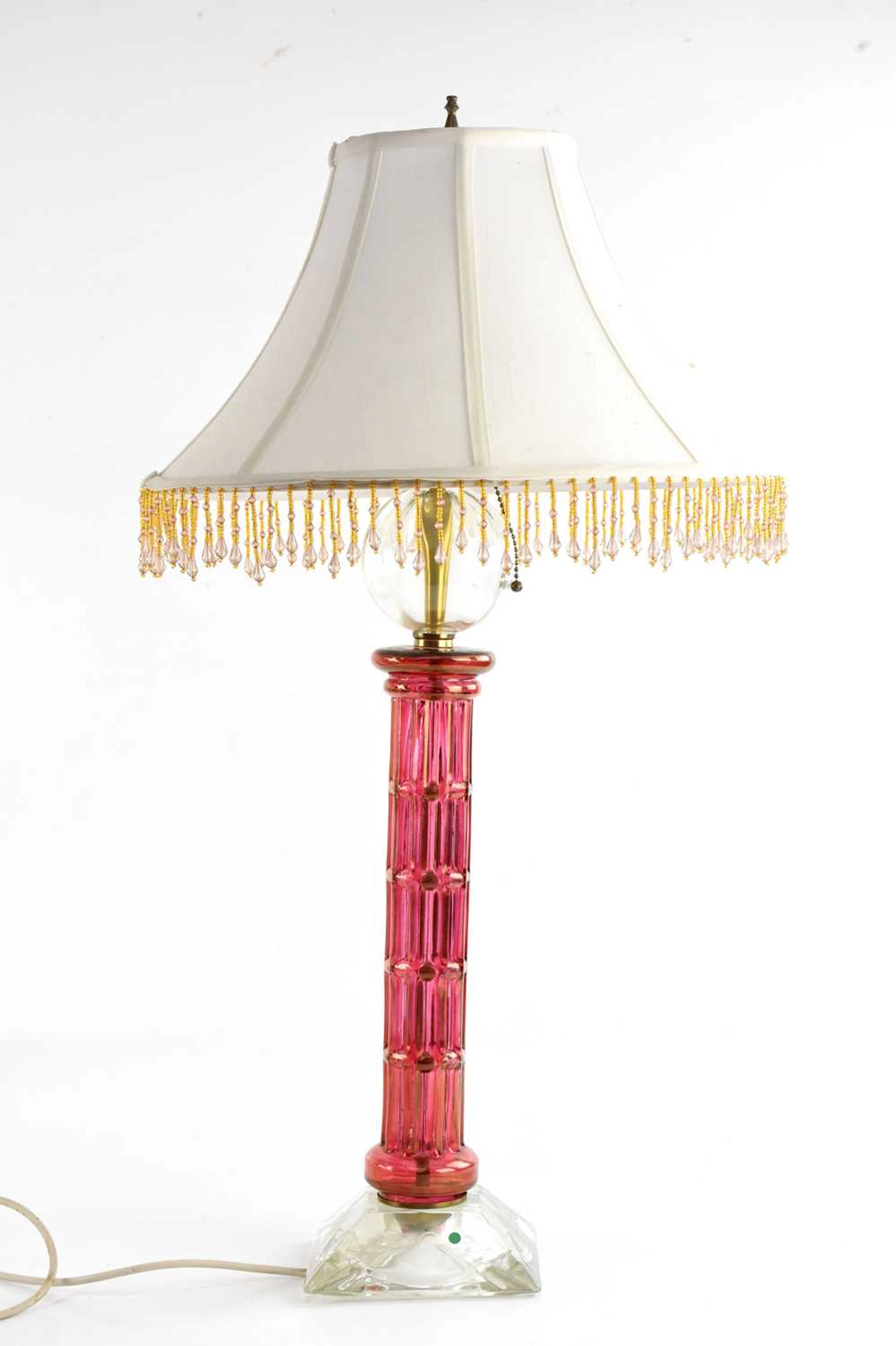 A cranberry and clear glass table lamp