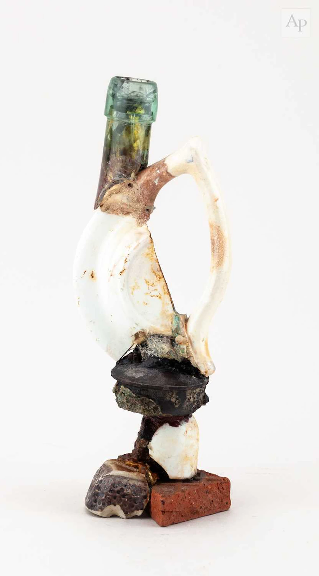 ROBERT COOPER (born 1949); a ceramic and glass collage...