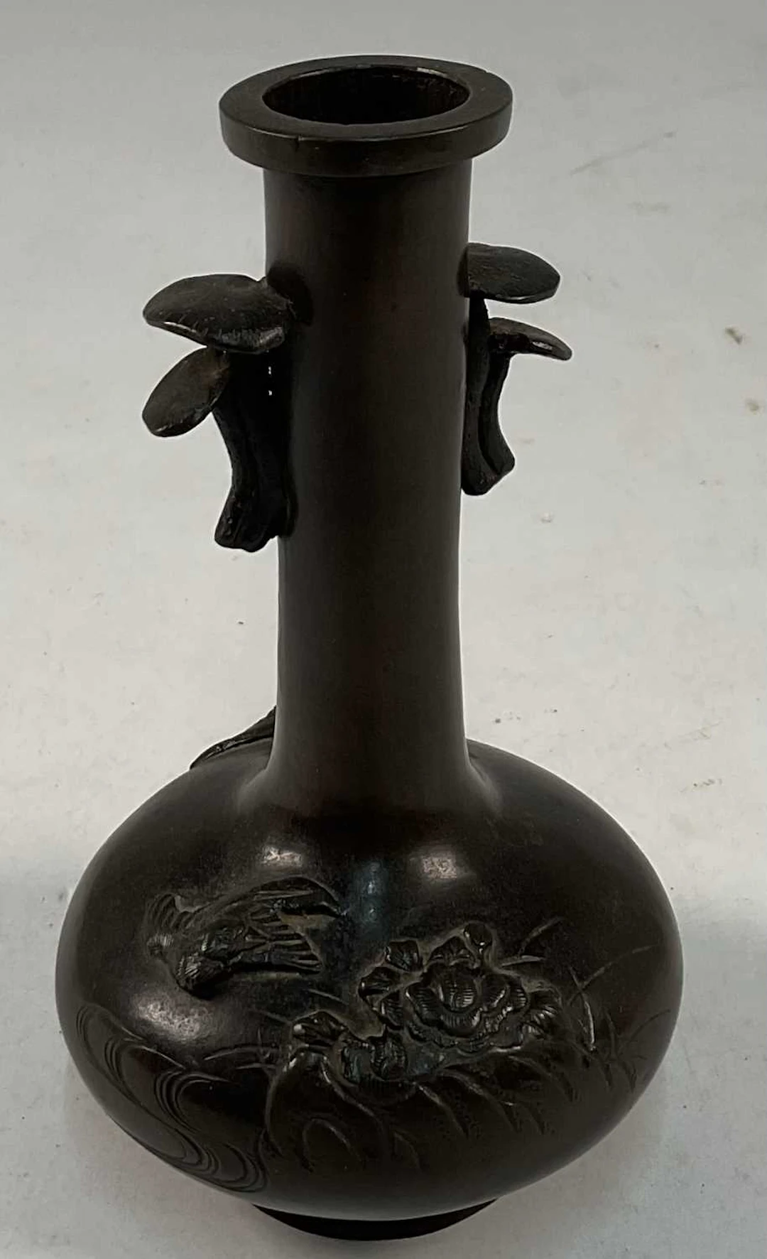 A 19th century Chinese bronze vase with raised floral...