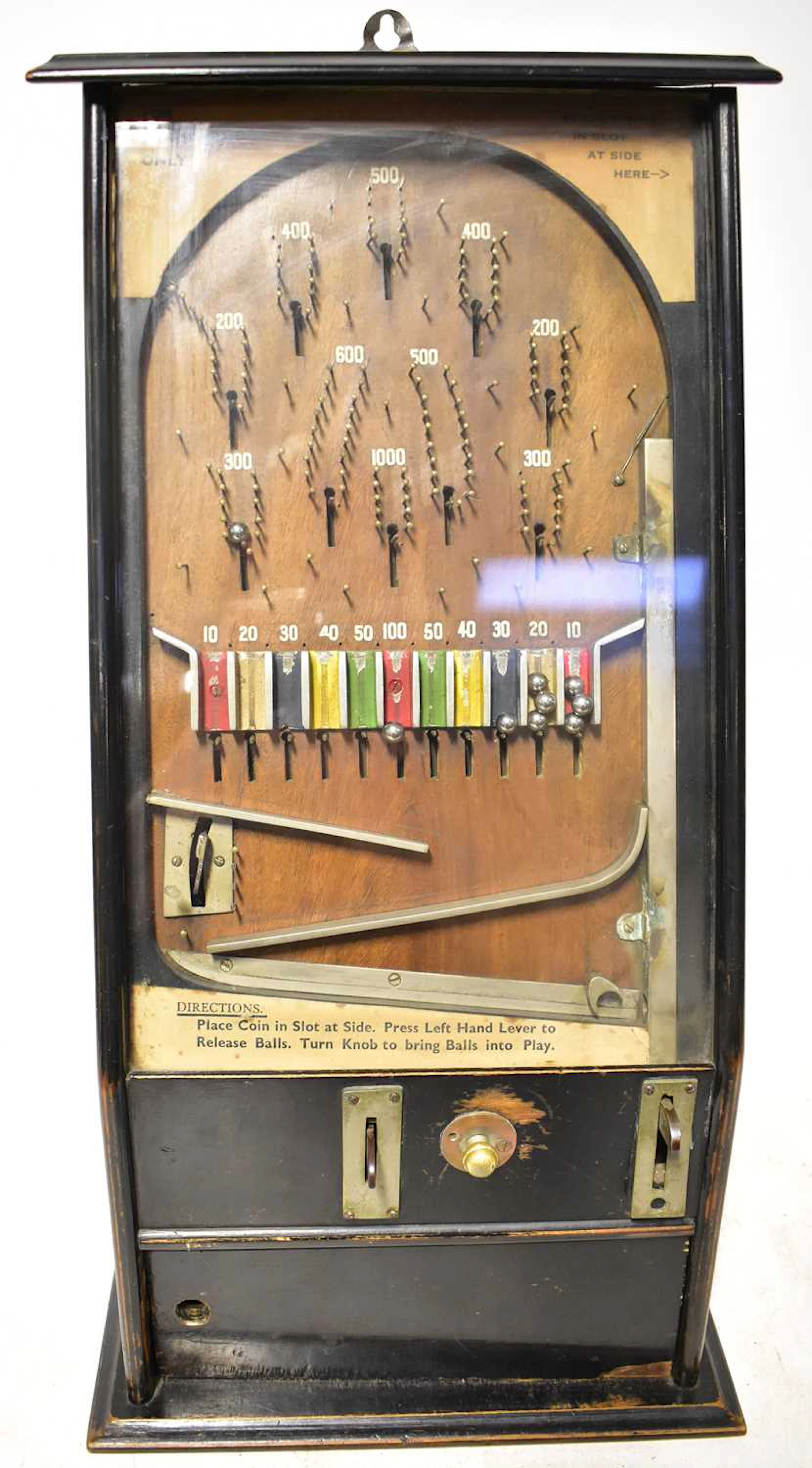 A vintage coin-operated upright table pinball machine