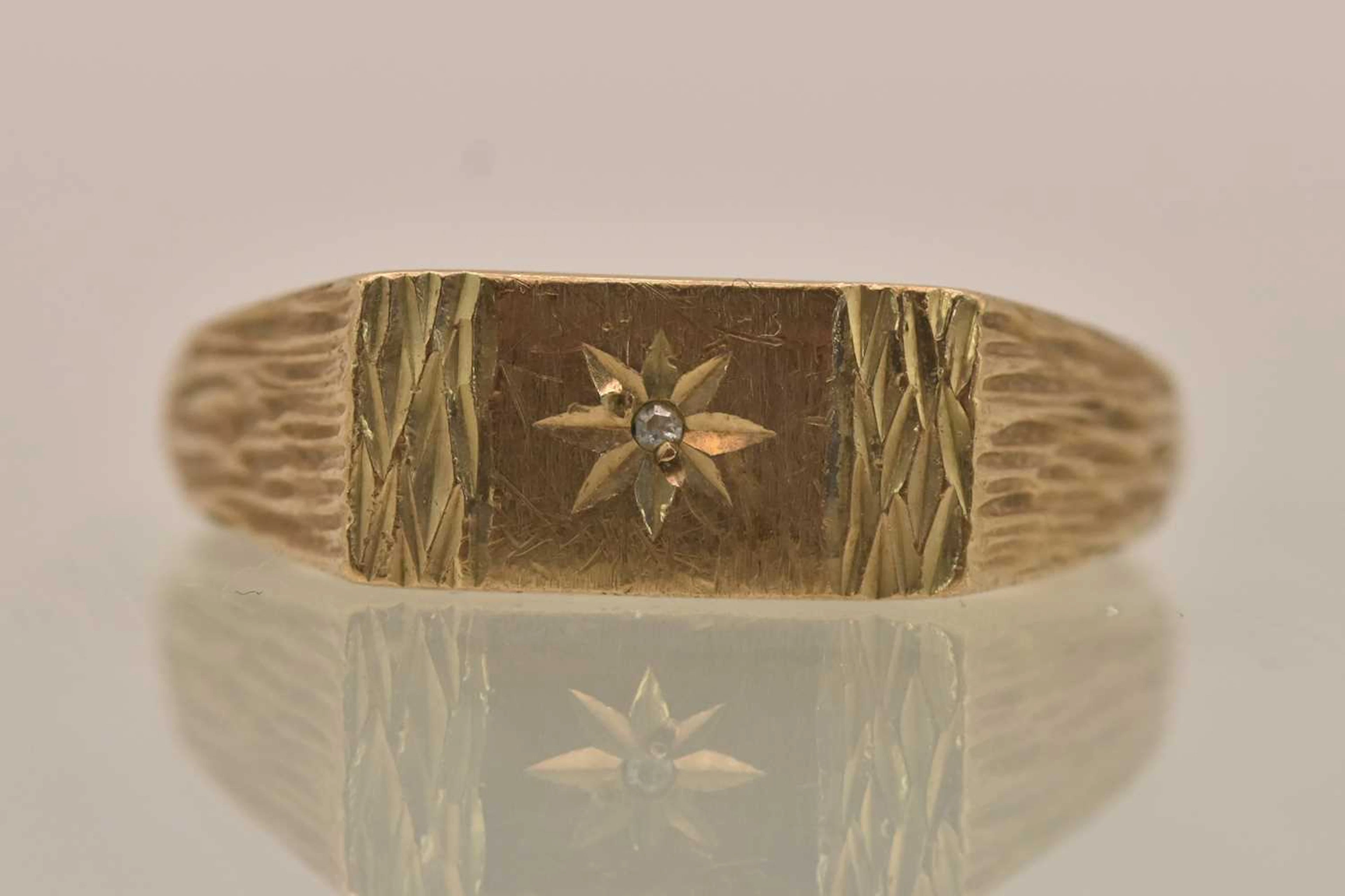 A 9ct yellow gold diamond set signet ring