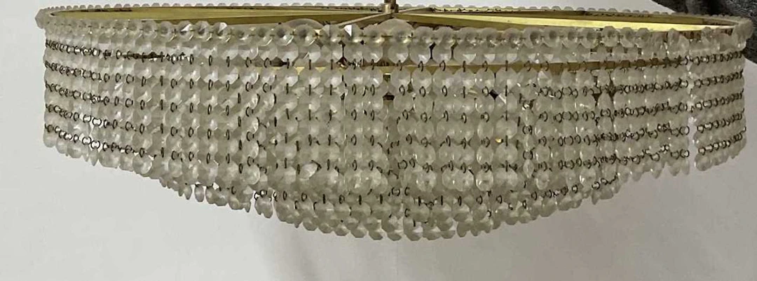 A mid 20th century multi tiered brass and crystal crown...