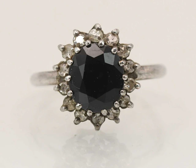 A 9ct white gold sapphire and diamond cluster ring