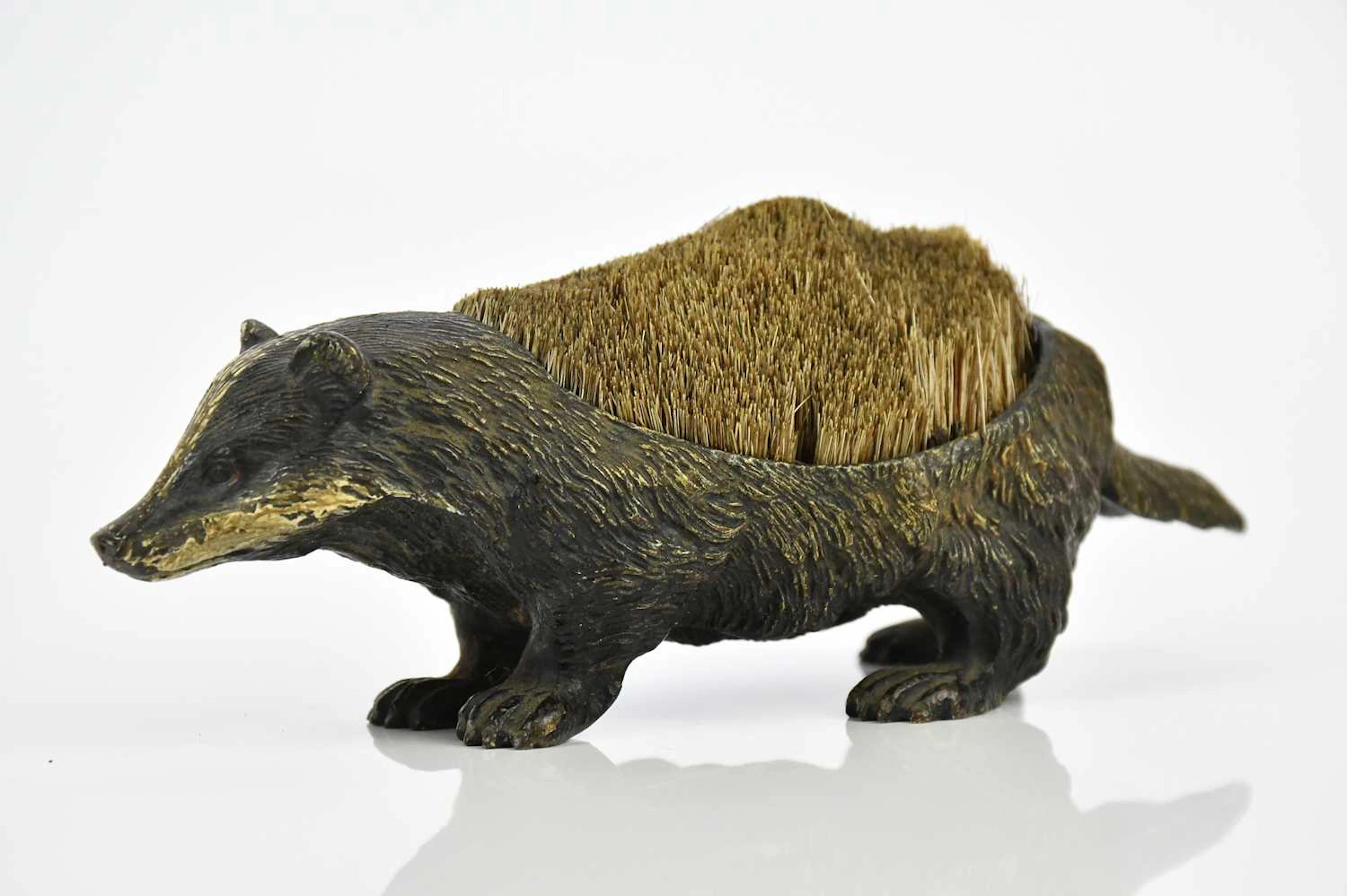 A cold painted bronze ink wipe in the form of a badger