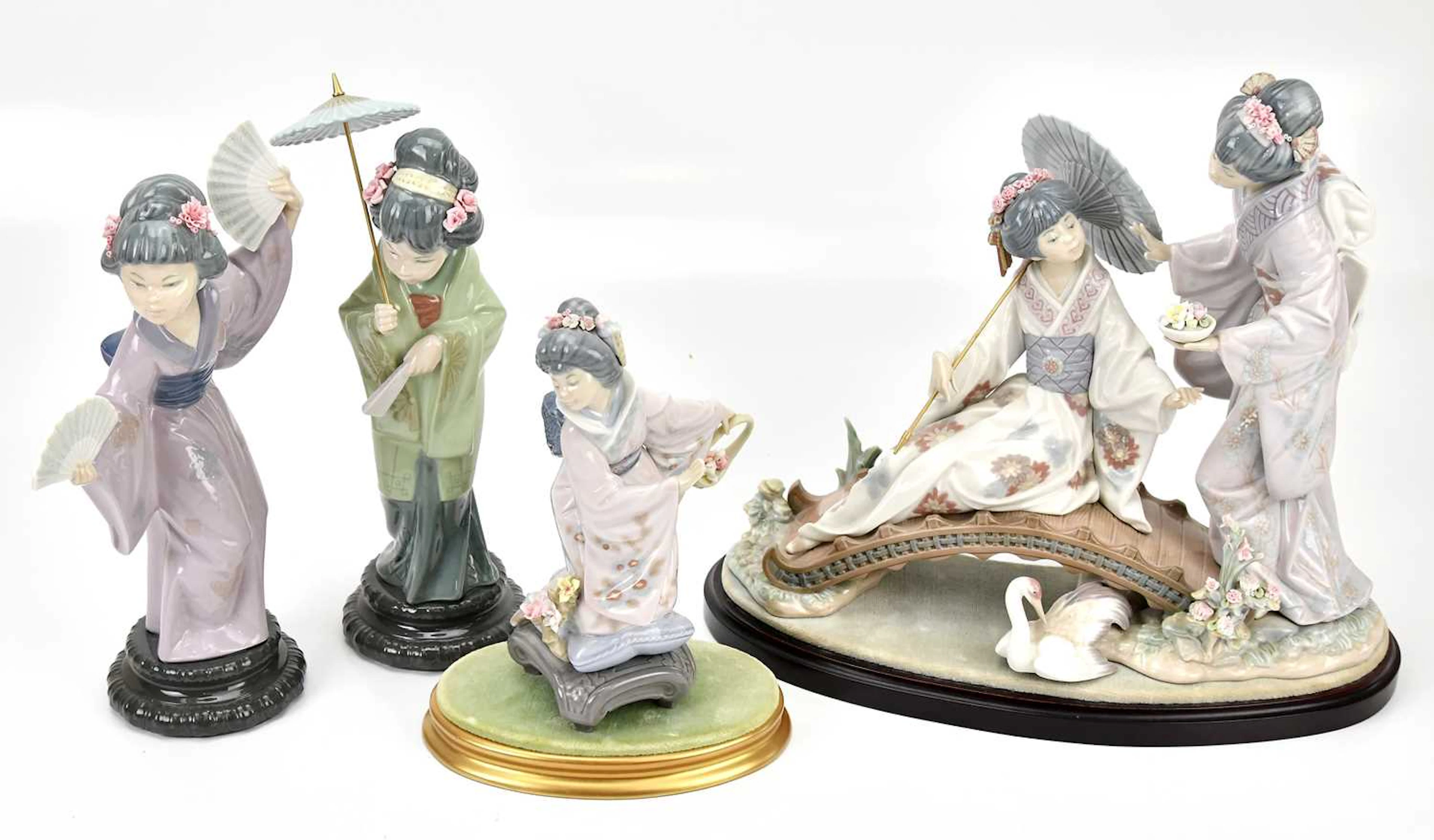 LLADRÓ; a group of four figures comprising 'Japanese with Parasol'