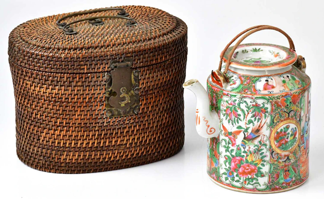 A 19th century Chinese Famille Rose teapot of cylindrical form with woven handle