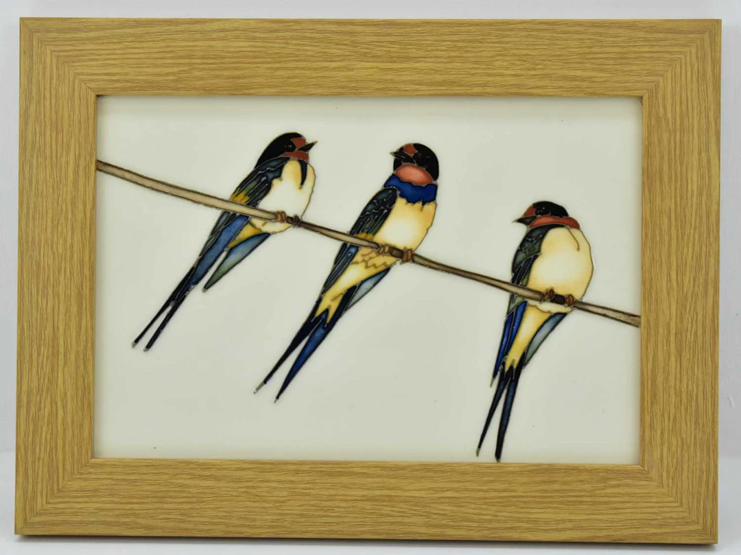 MOORCROFT; a 'Swing By' pattern plaque featuring three swallows on a branch
