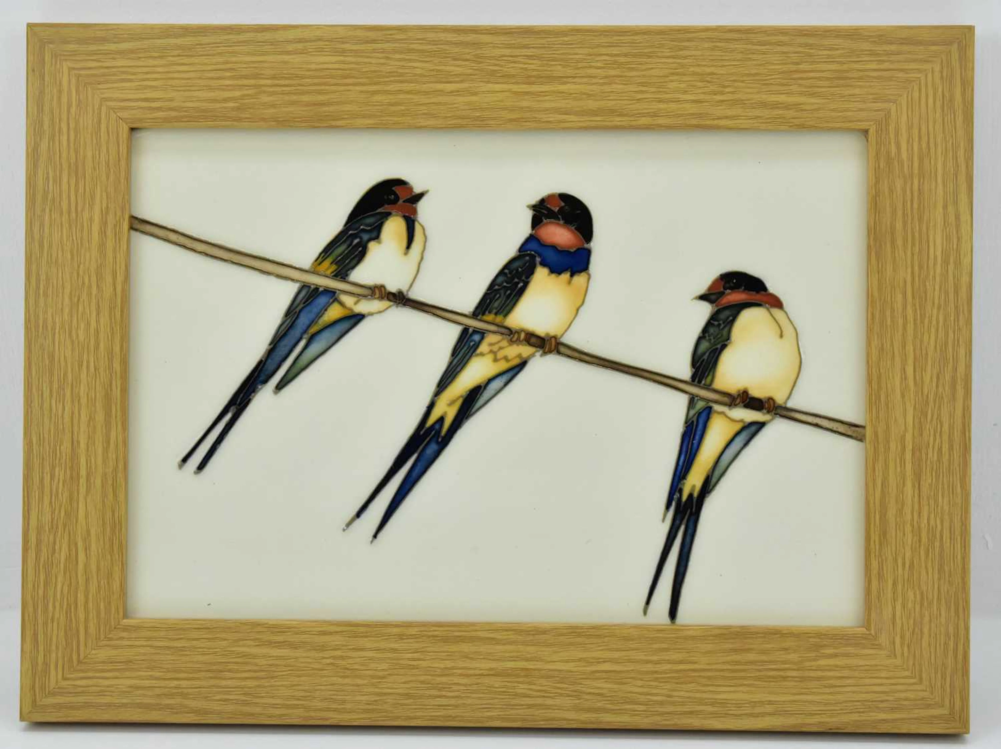 MOORCROFT; a 'Swing By' pattern plaque featuring three swallows on a branch