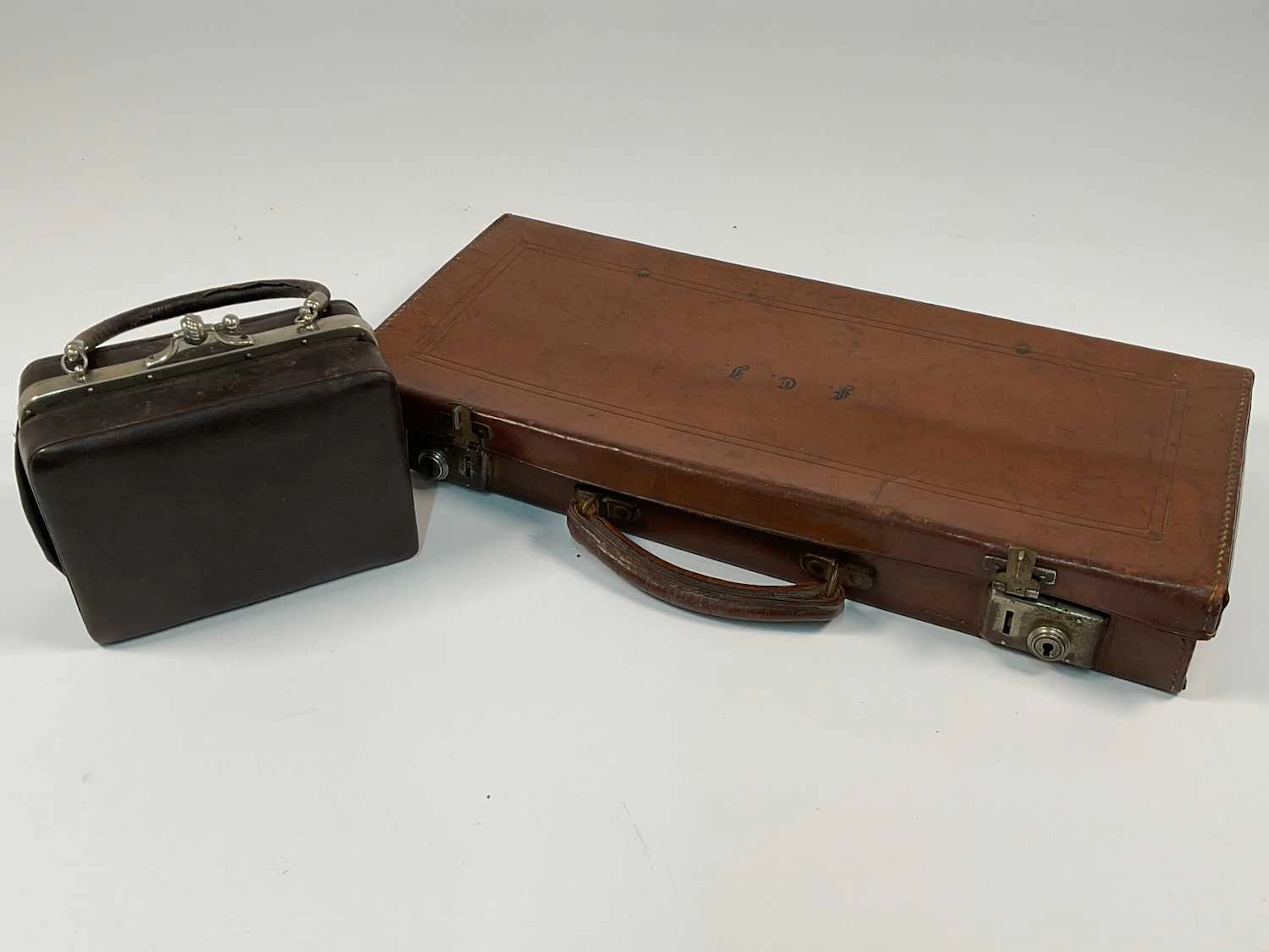 A vintage leather handbag with chrome detailing
