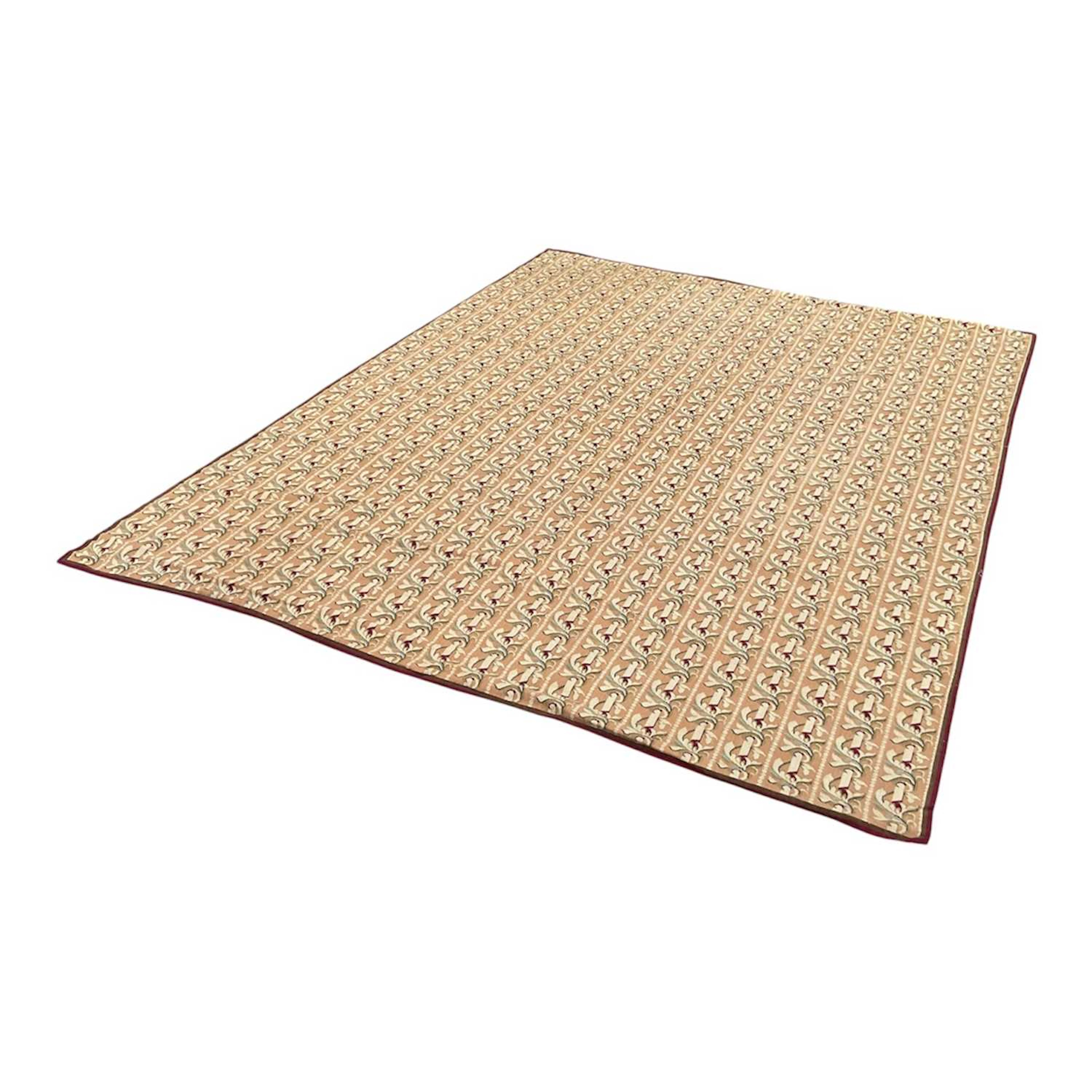A good needlepoint rug with stylised floral decoration