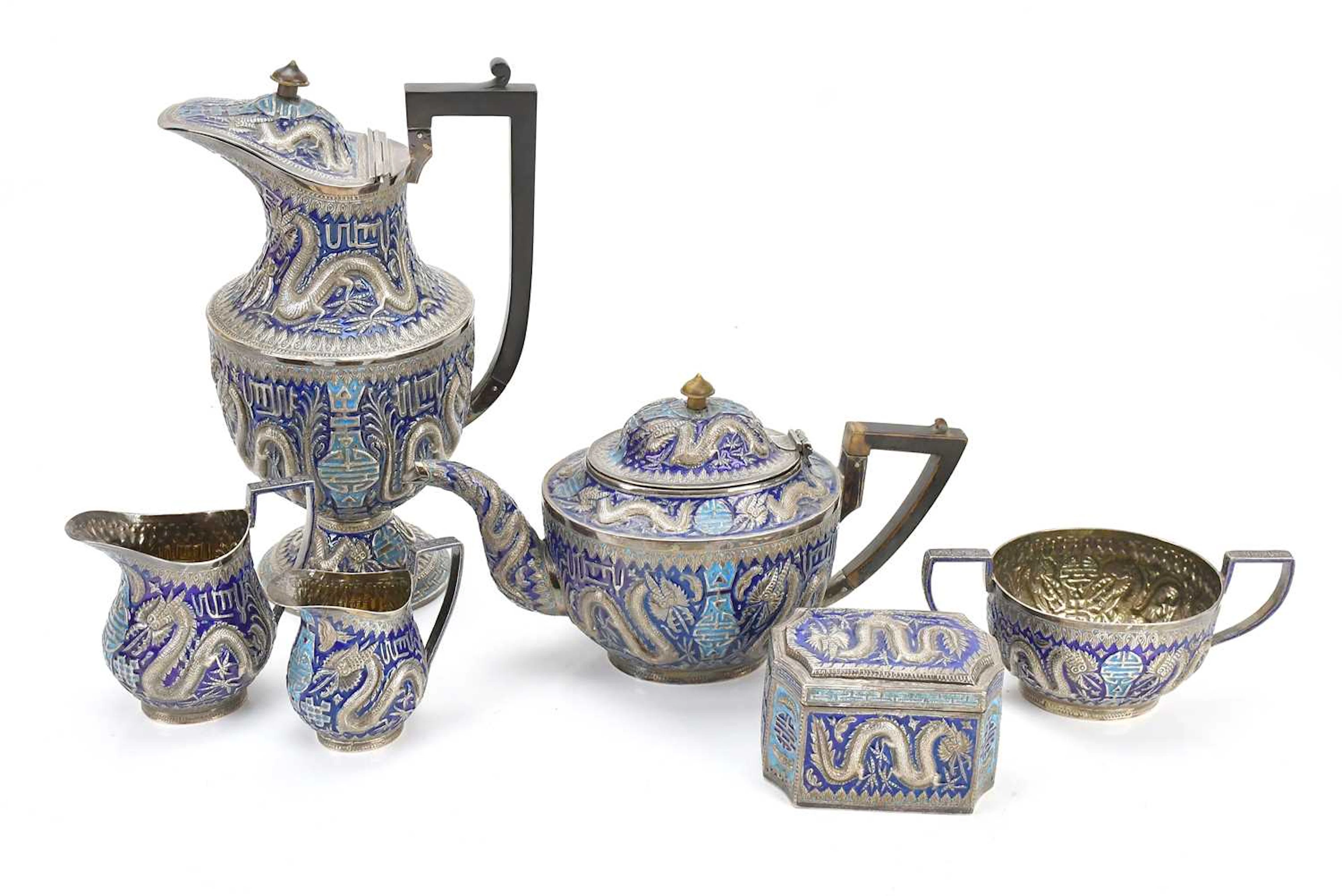 A good Chinese white metal and enamel four piece...