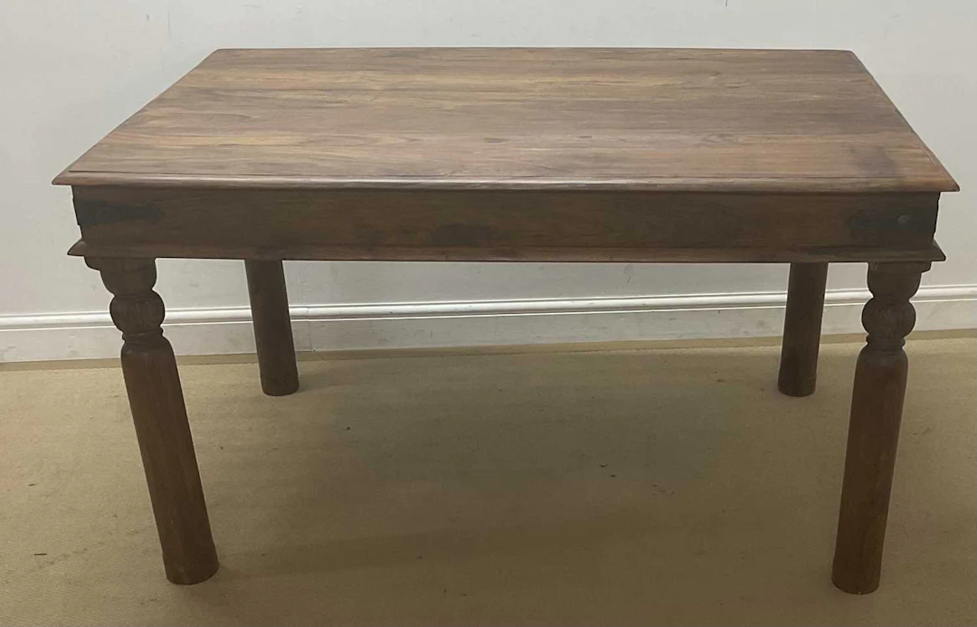 A stained pine table of rectangular form