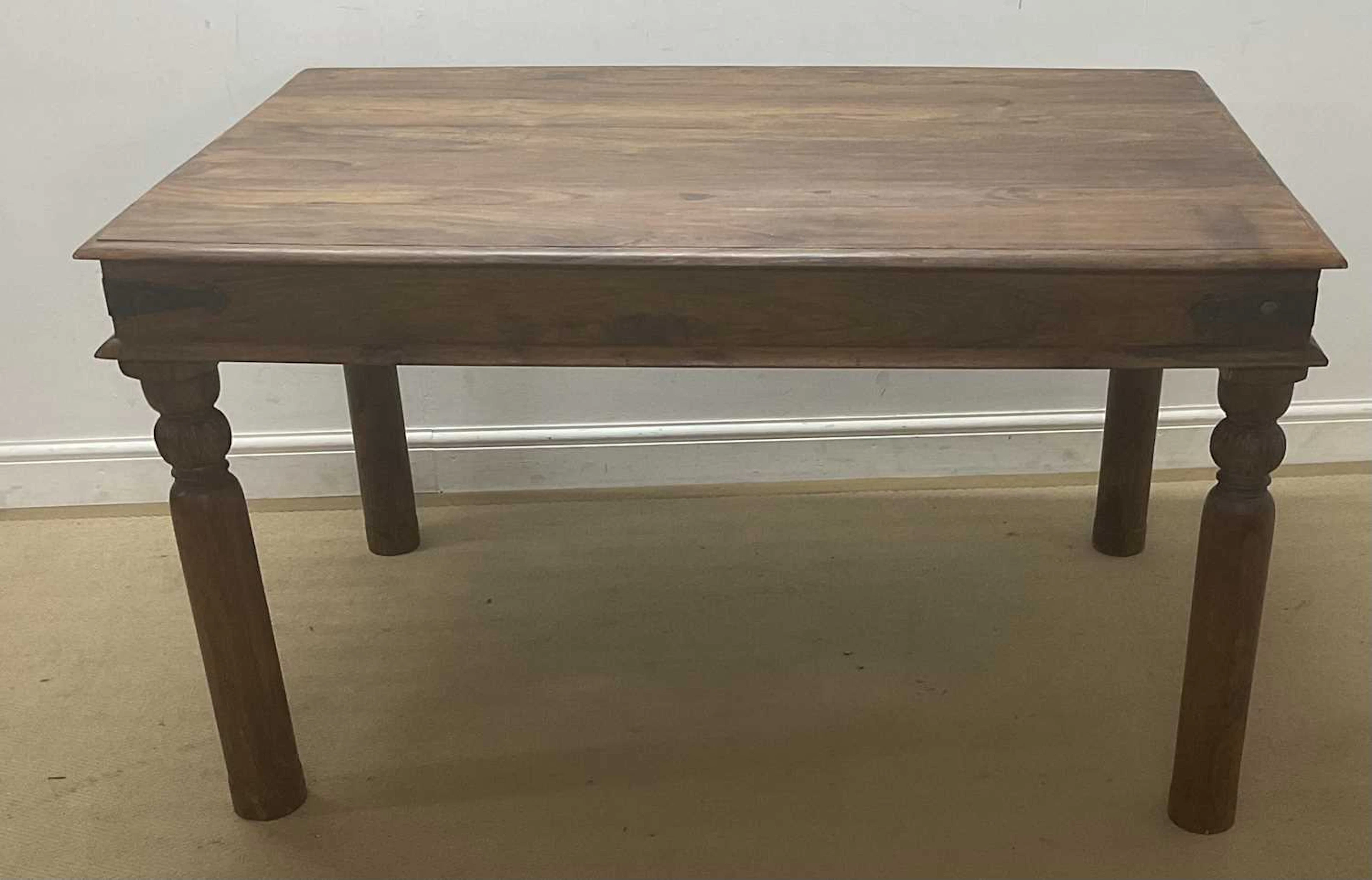 A stained pine table of rectangular form