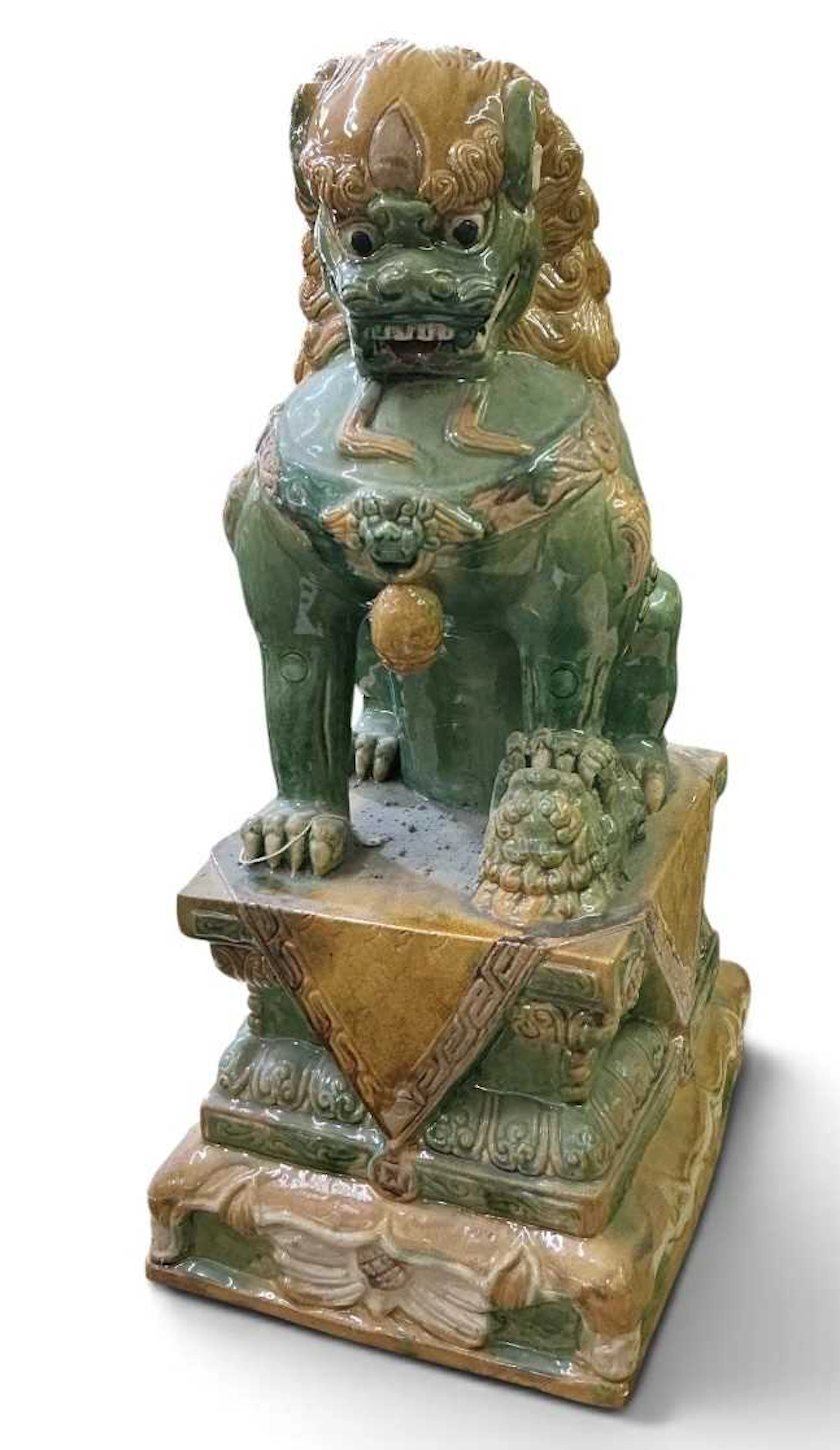 A large Chinese Sancai glazed porcelain figure of a seated temple dog